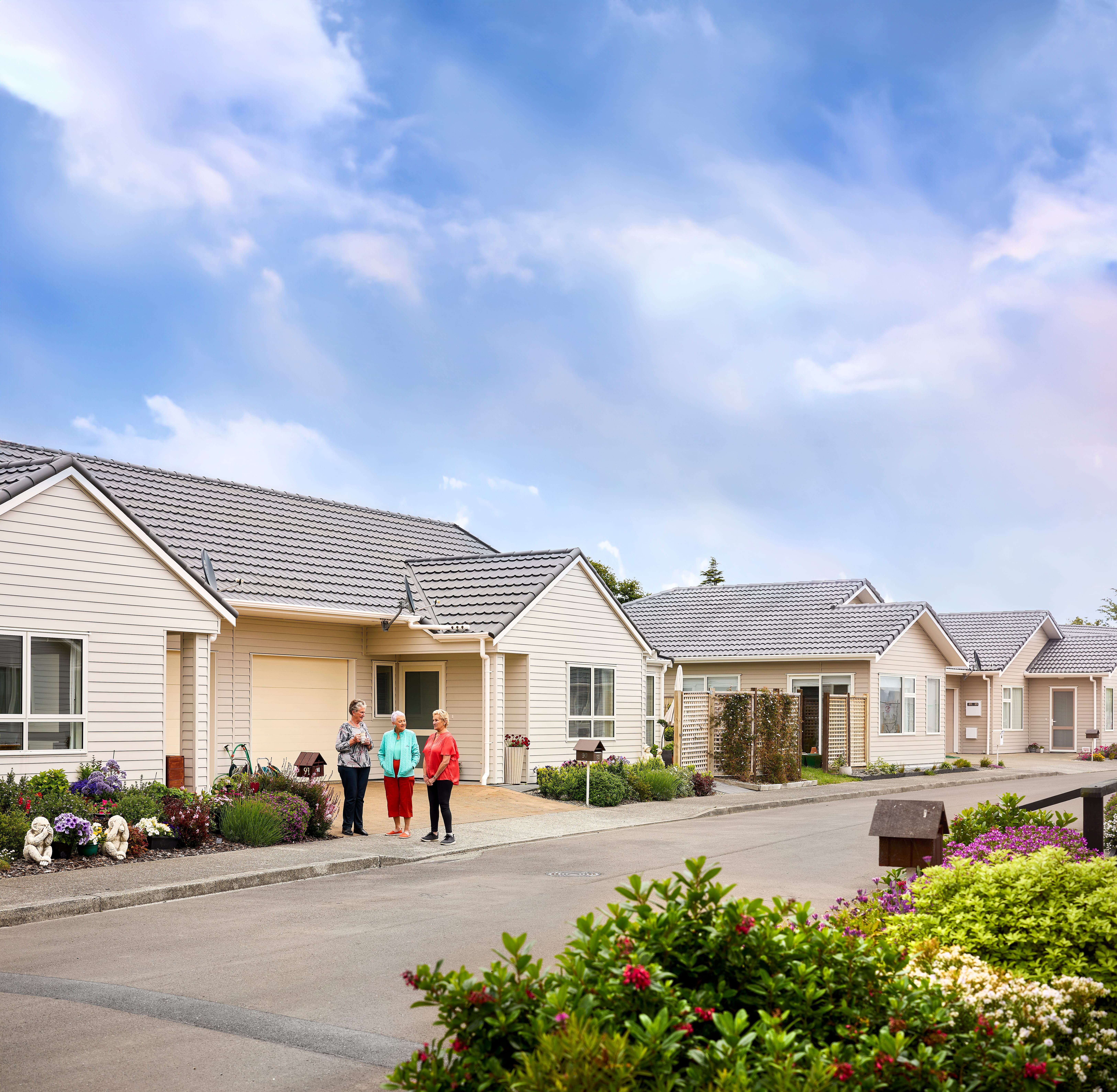 Residents outside villas at Coastal Villas
