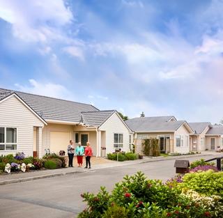 Residents outside villas at Coastal Villas
