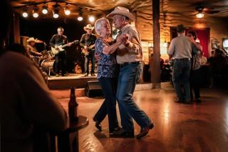 Residents dancing in hall with band playing