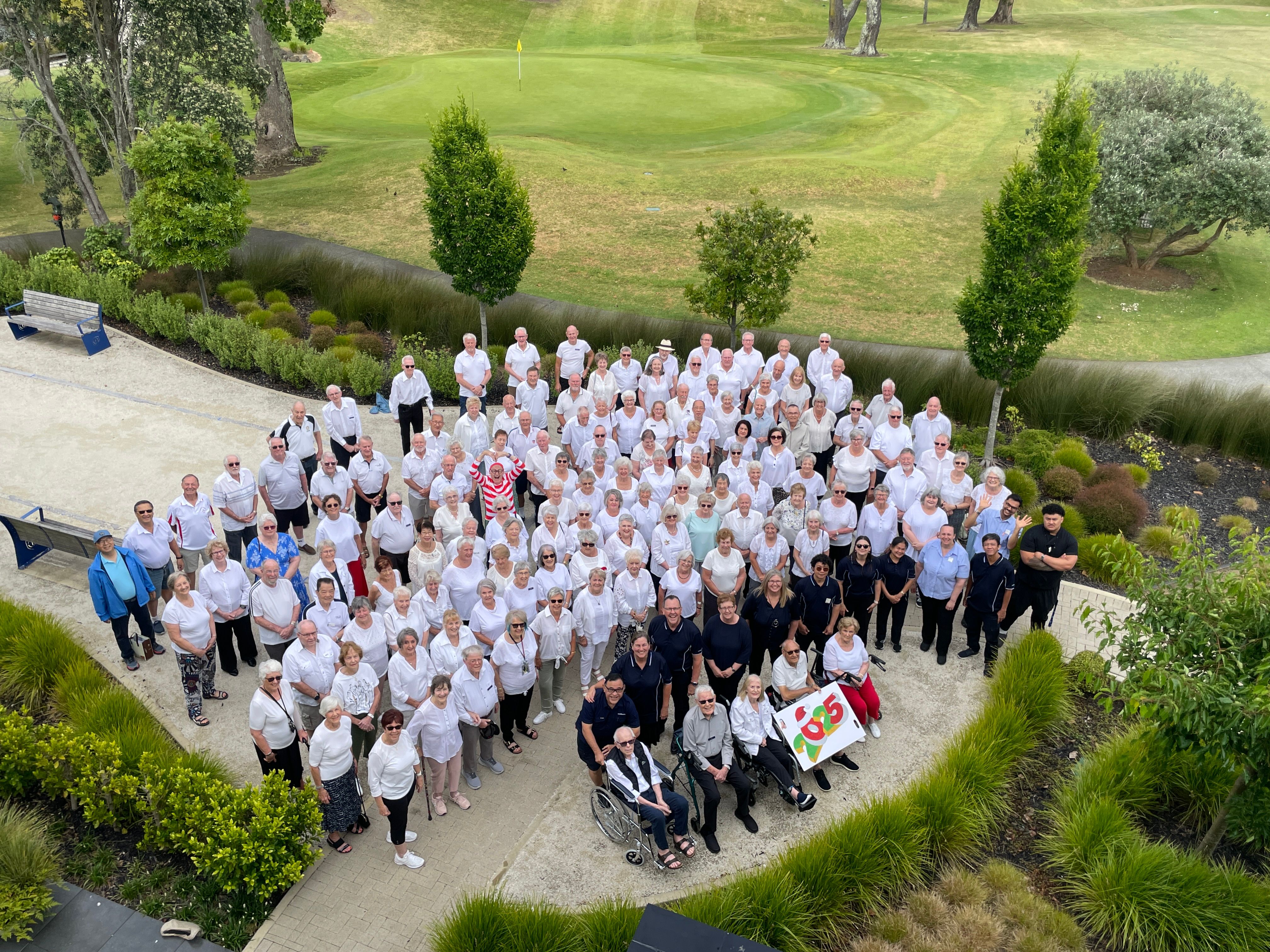 A group photo of residents and staff at Fairway Gardens