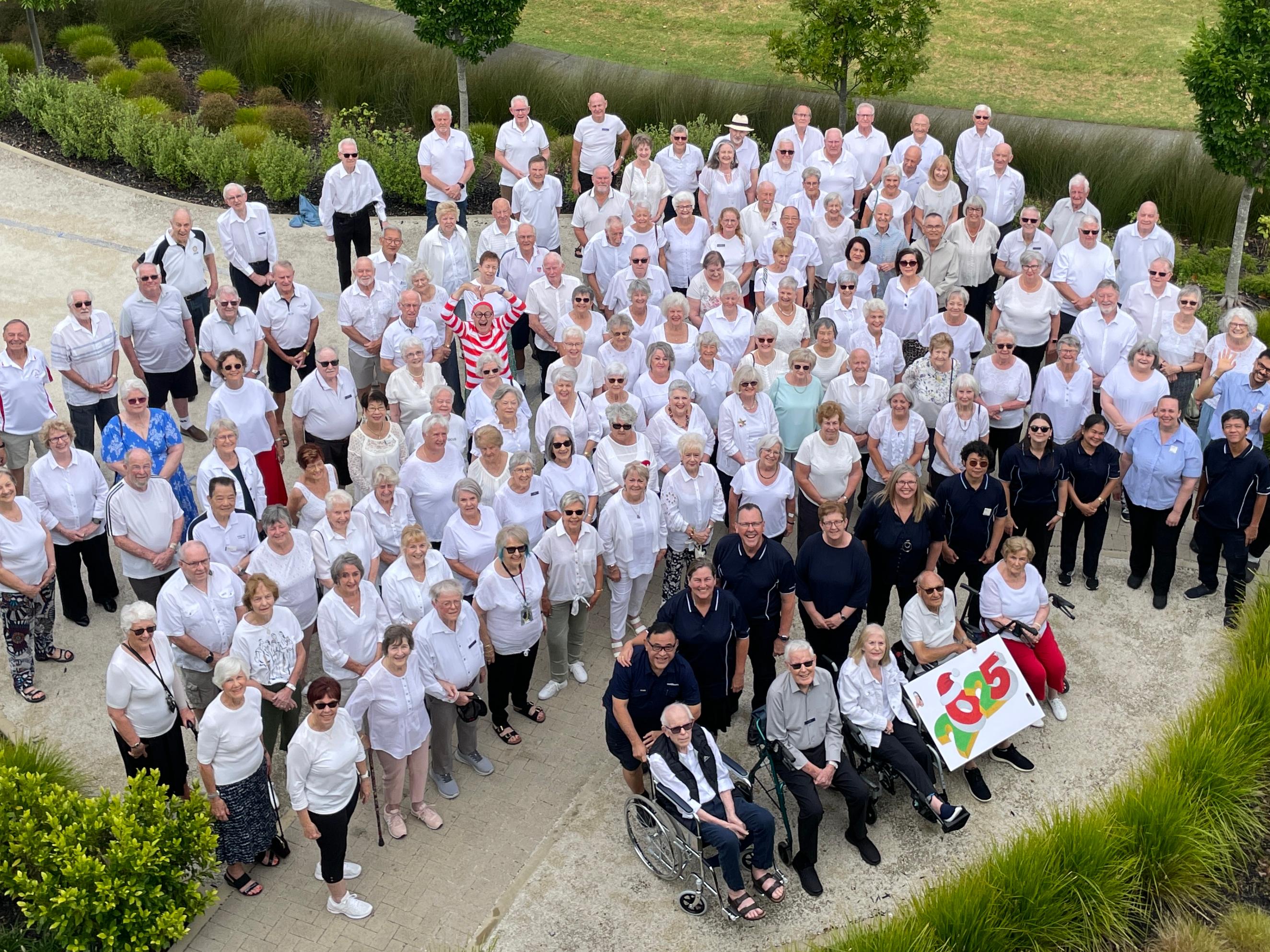 A group photo of residents and staff at Fairway Gardens