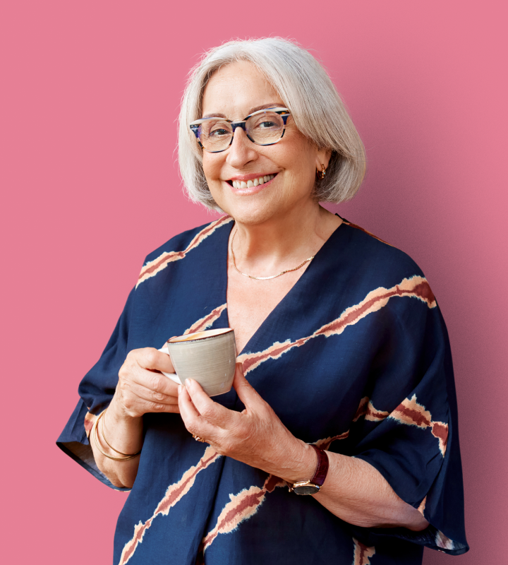 Resident with mug on pink