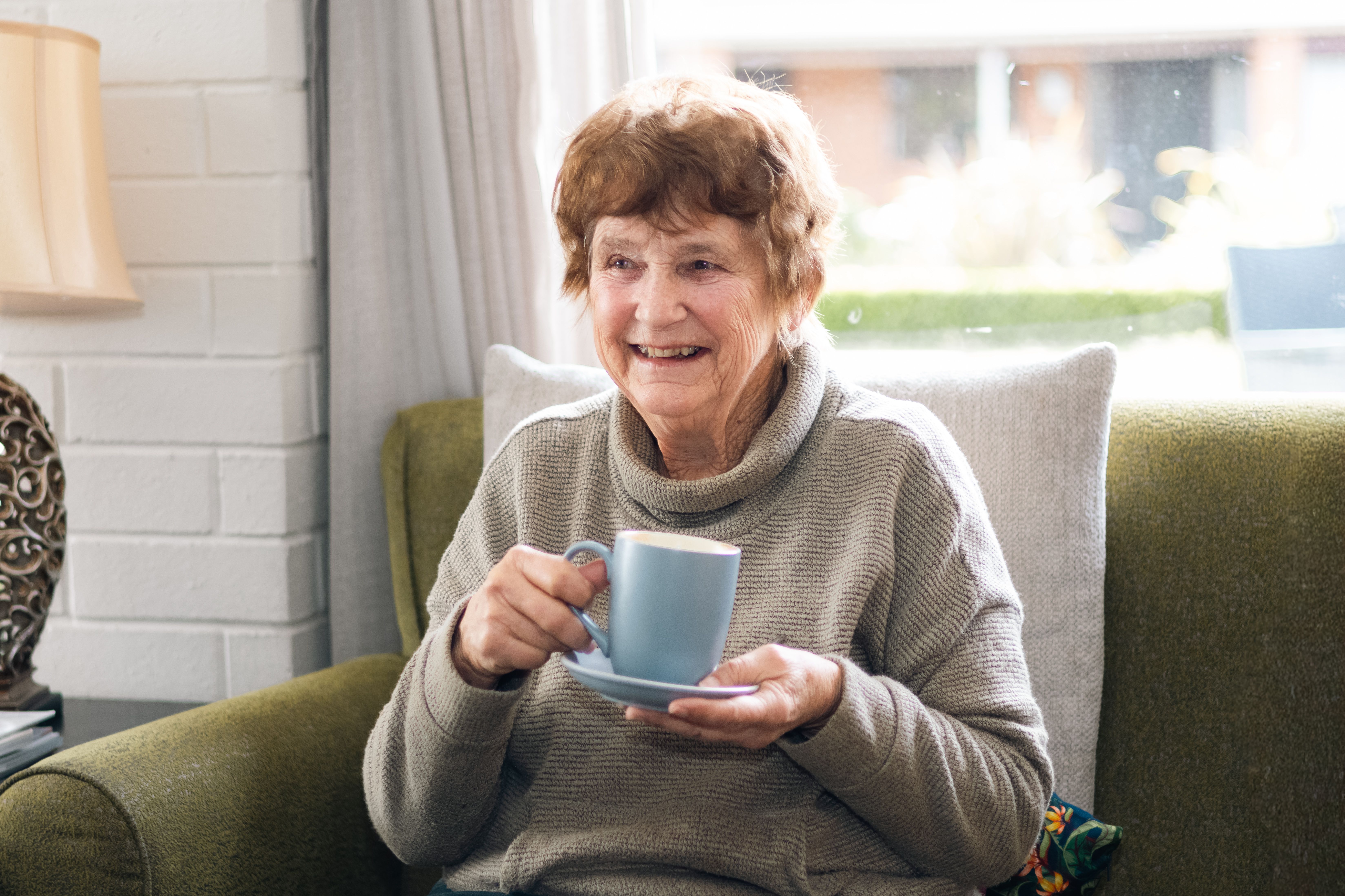 Resident having coffee