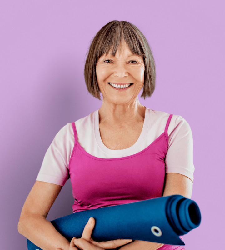 Resident with yoga mat on purple