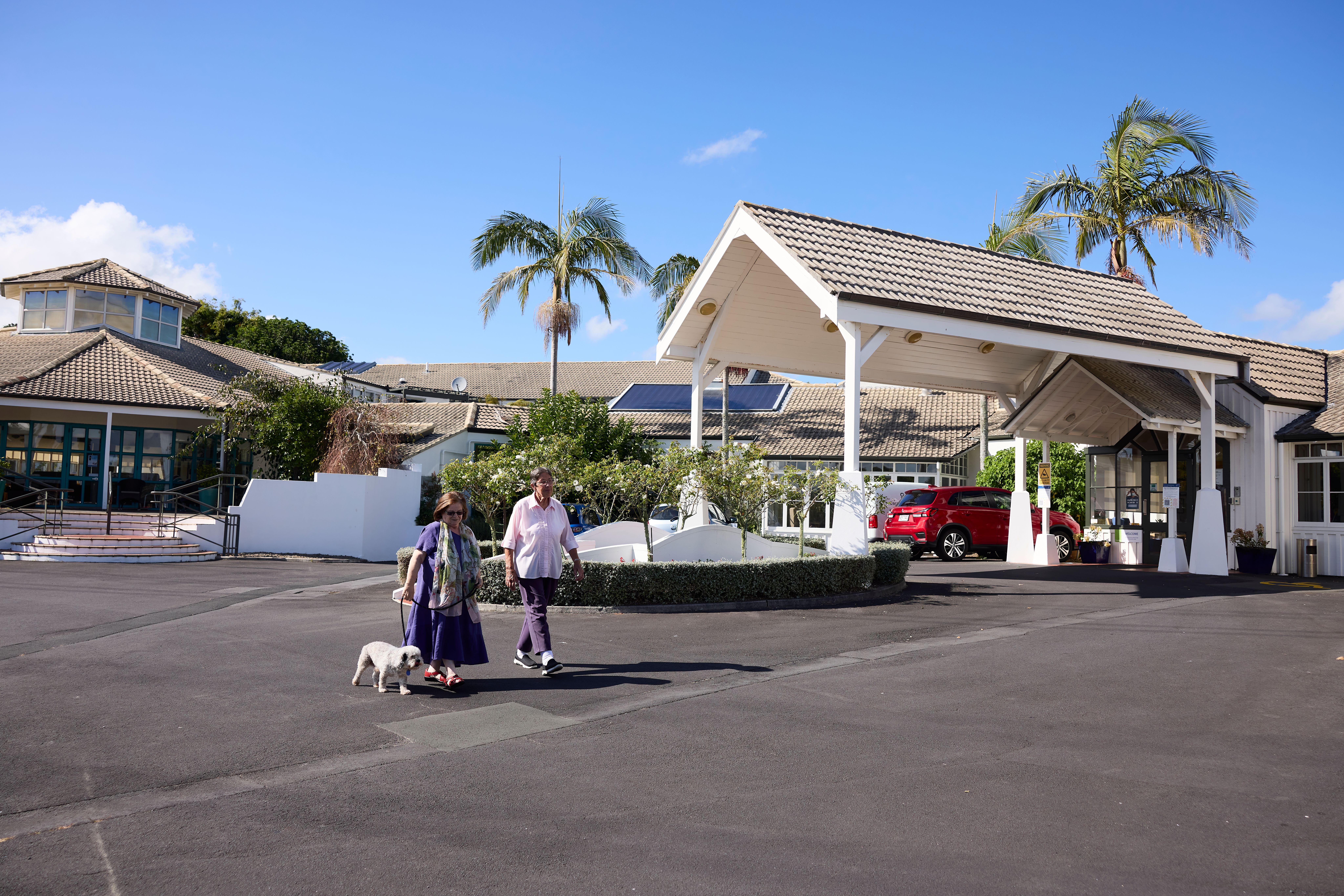 Exterior entrance at Powley with resident and dog