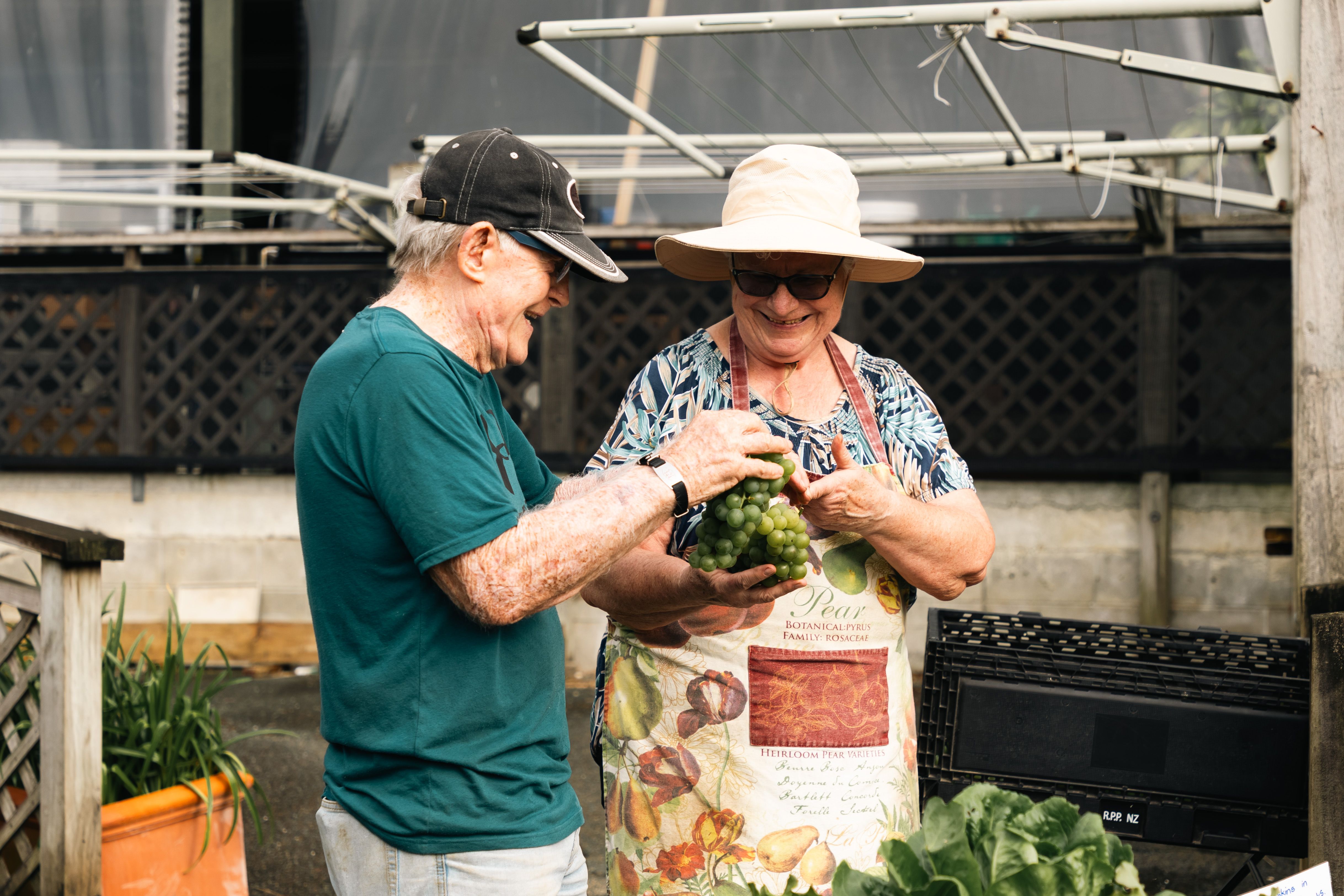 Lady and friend gardening at Waitakere Village