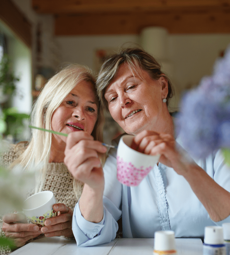 wo women enjoying creative time together at a Metlifecare retirement village community.