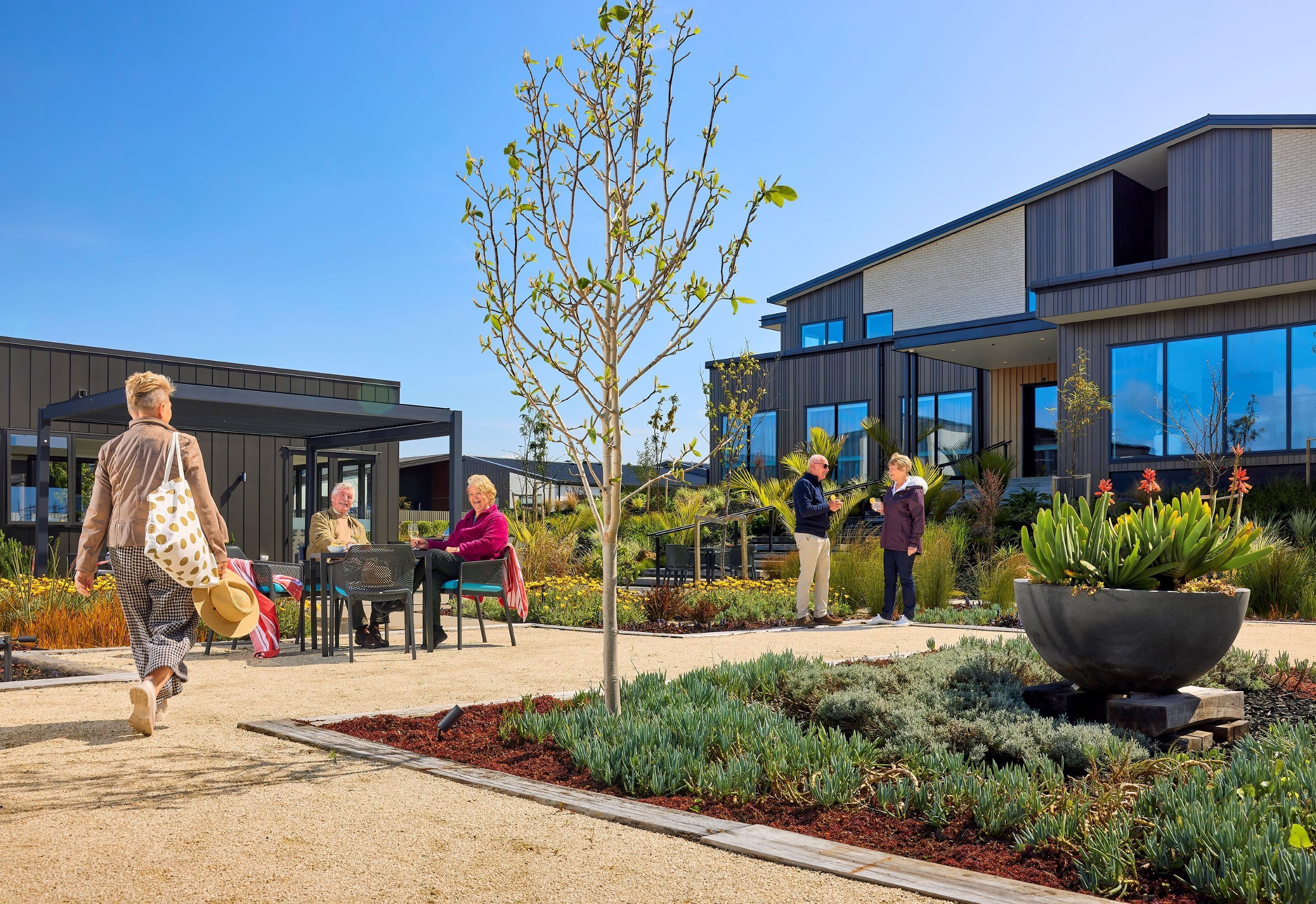 Residents enjoying outdoor area at Pohutukawa Landing