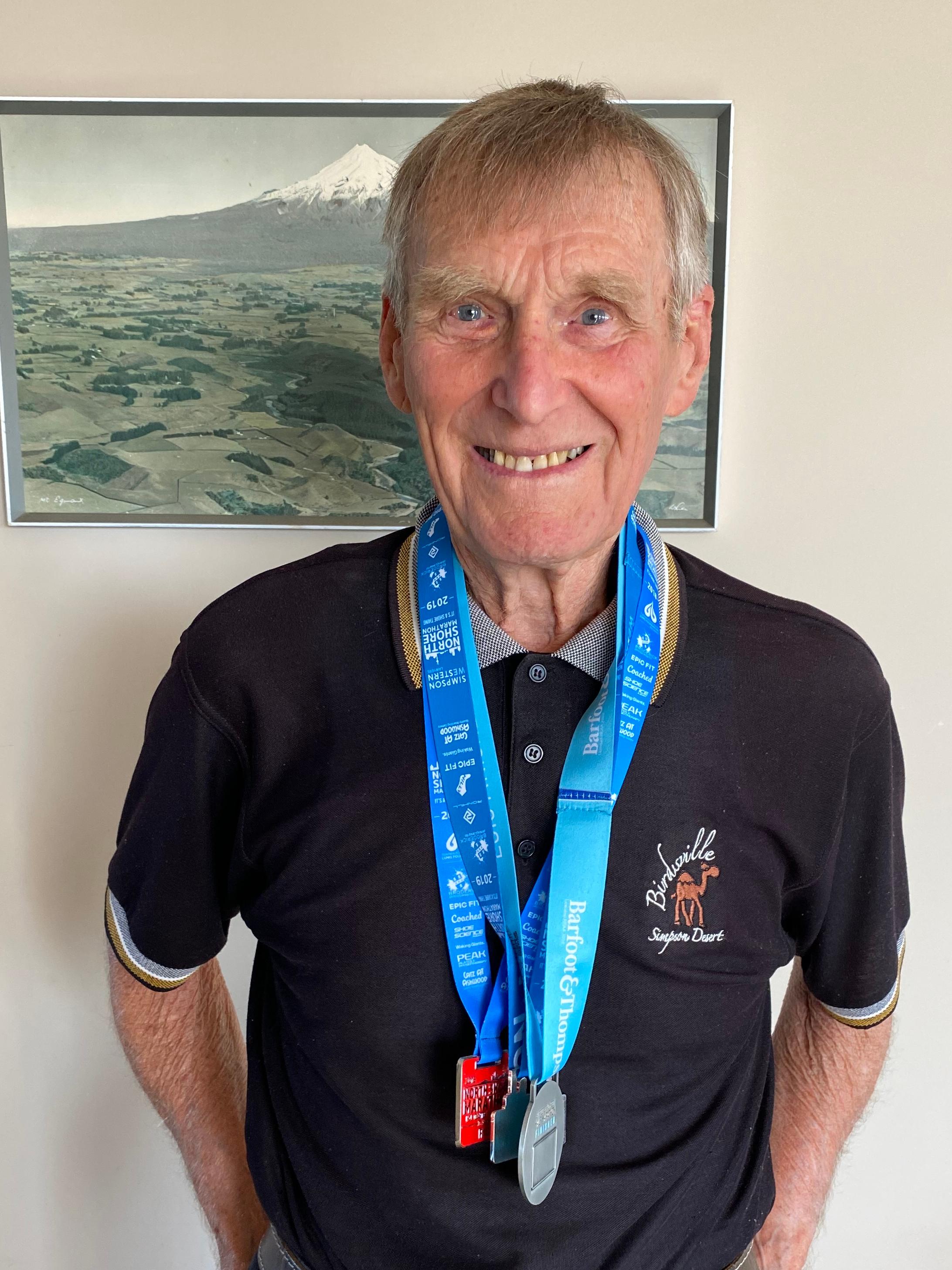 Ray Urbhan with his marathon medals