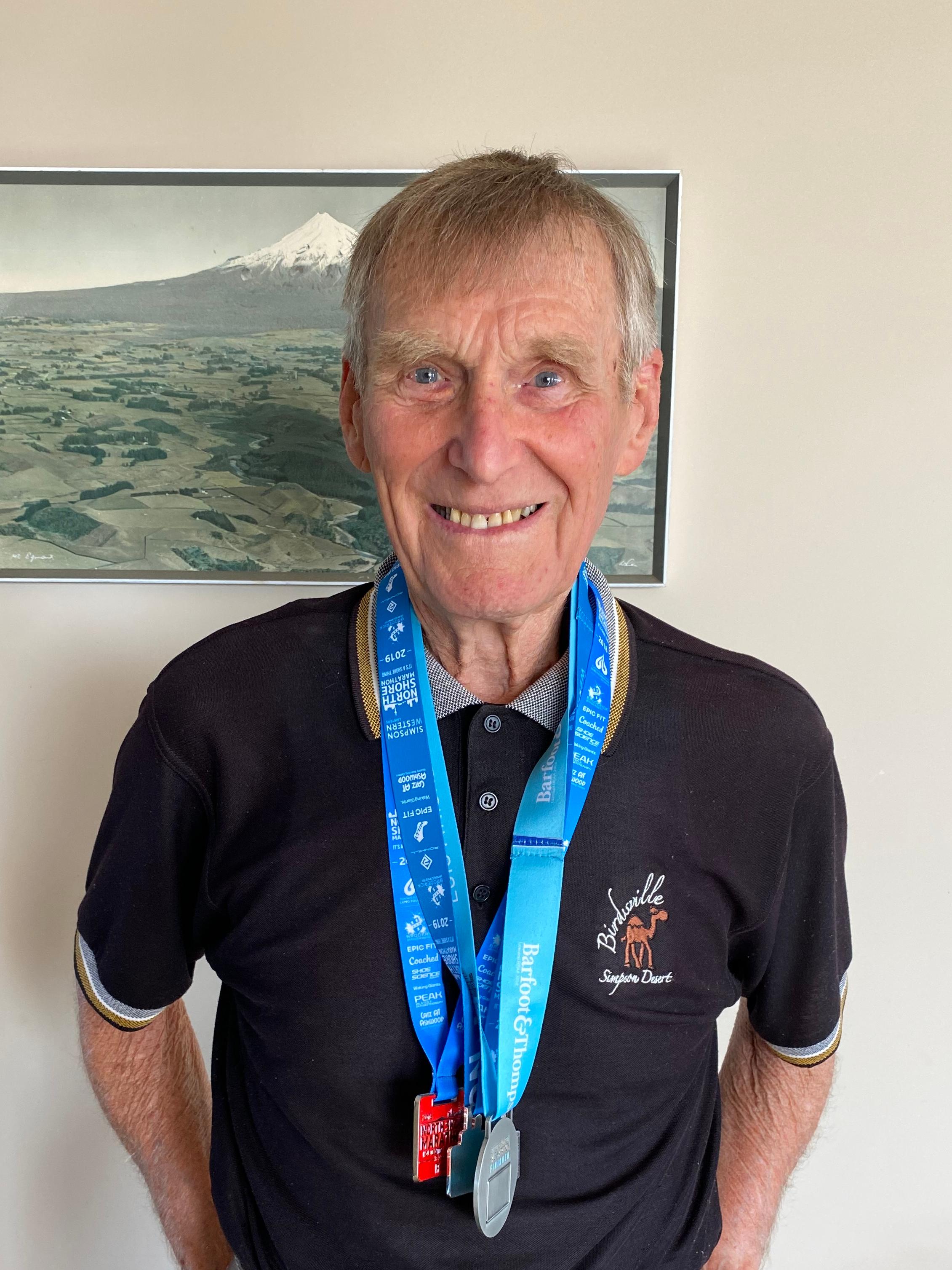 Ray Urbhan with his marathon medals