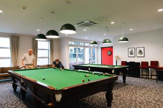 Residents playing pool