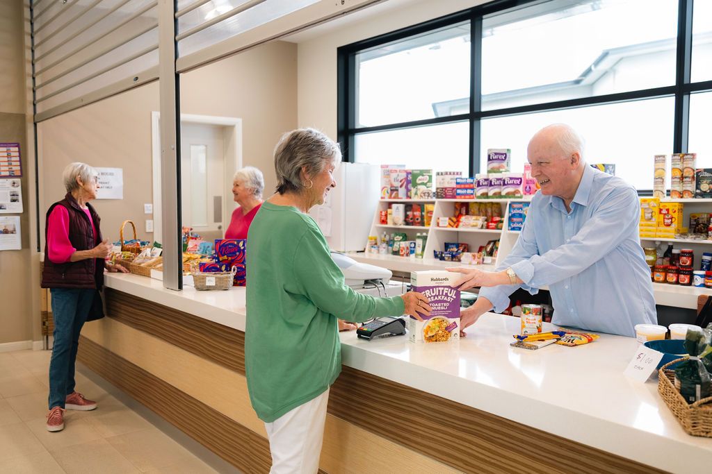 Convenience store with residents smiling