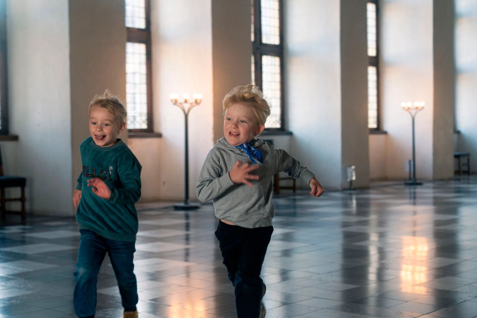 Two boys running in the dance hall