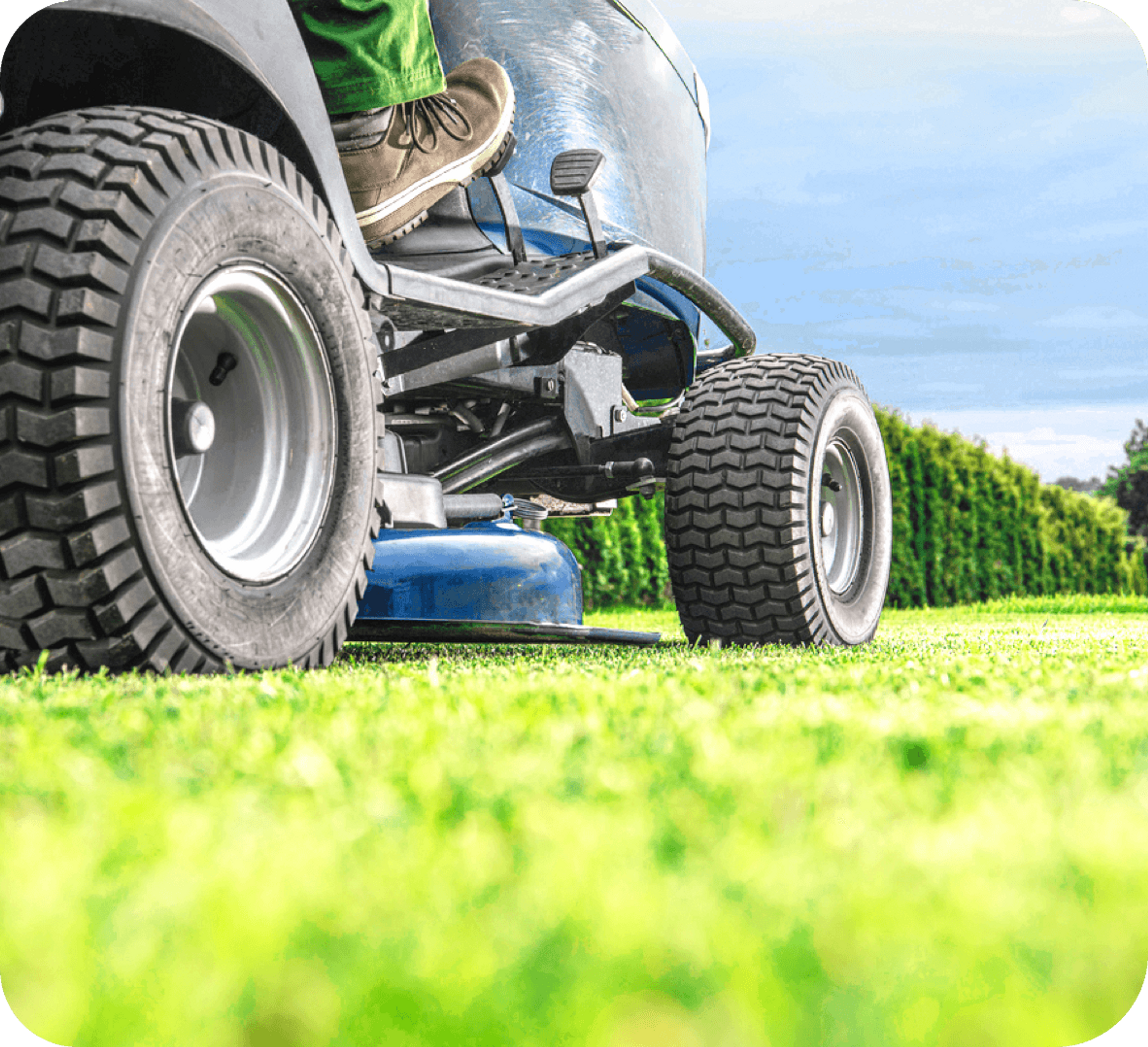 Closeup of lawn mower on grass