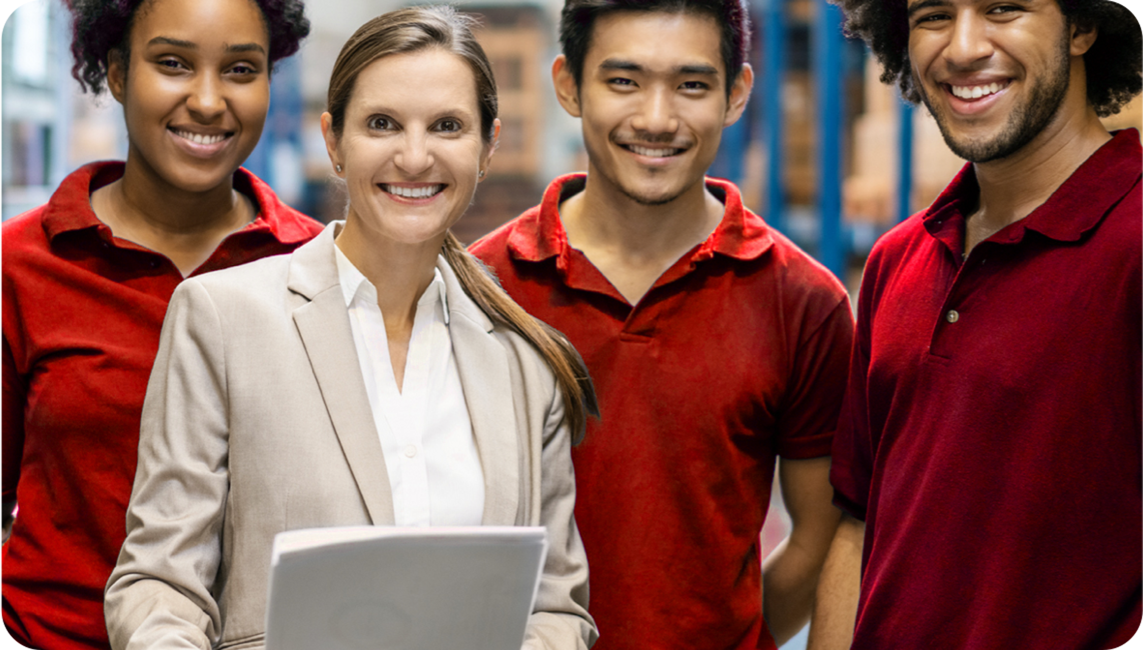 Picture of 4 multi ethnic adullts , the woman is Caucasian woman wearing a cream blazer while the ethnic people wear a red polo shirt