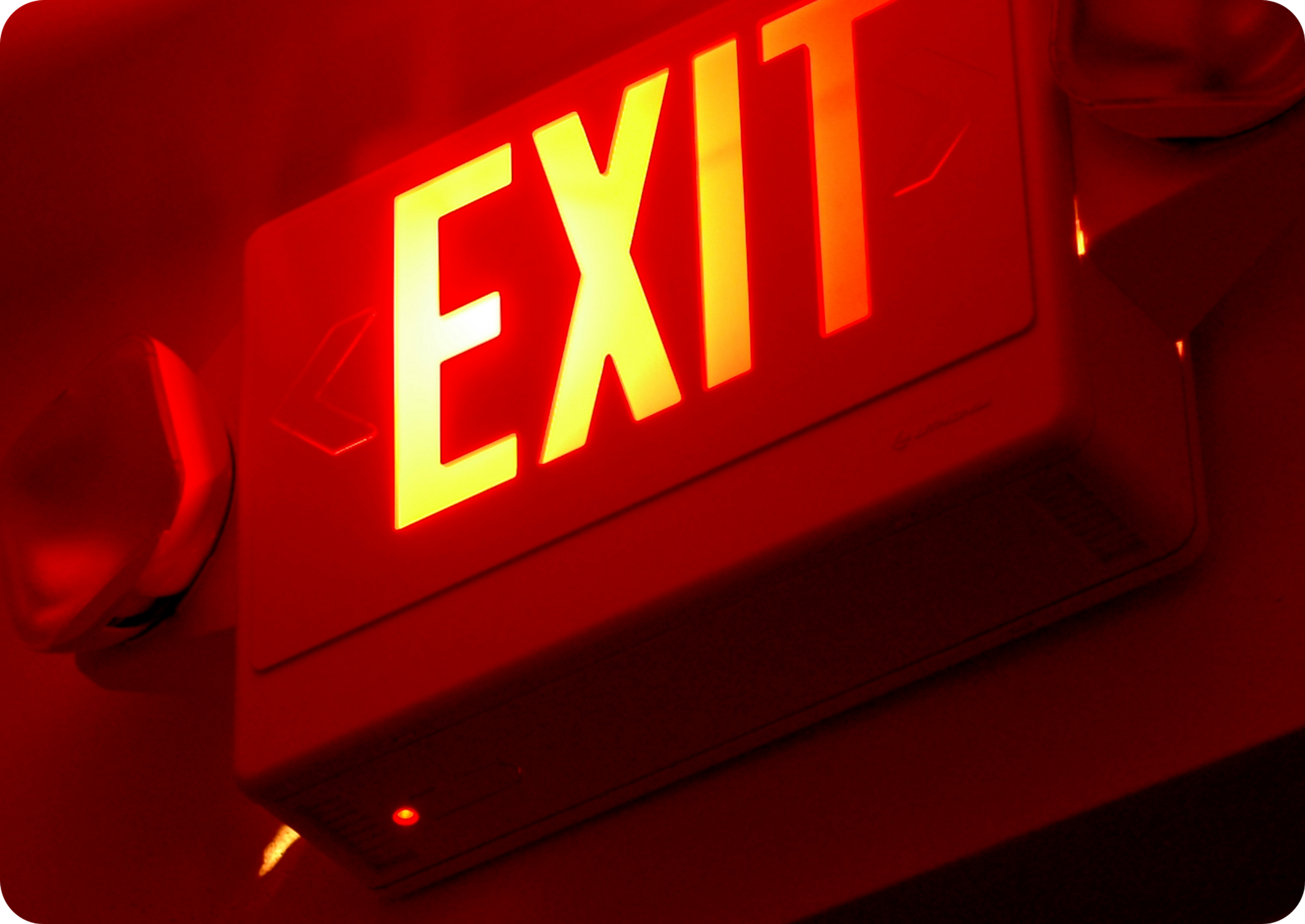Picture of "EXIT" sign glowing red 