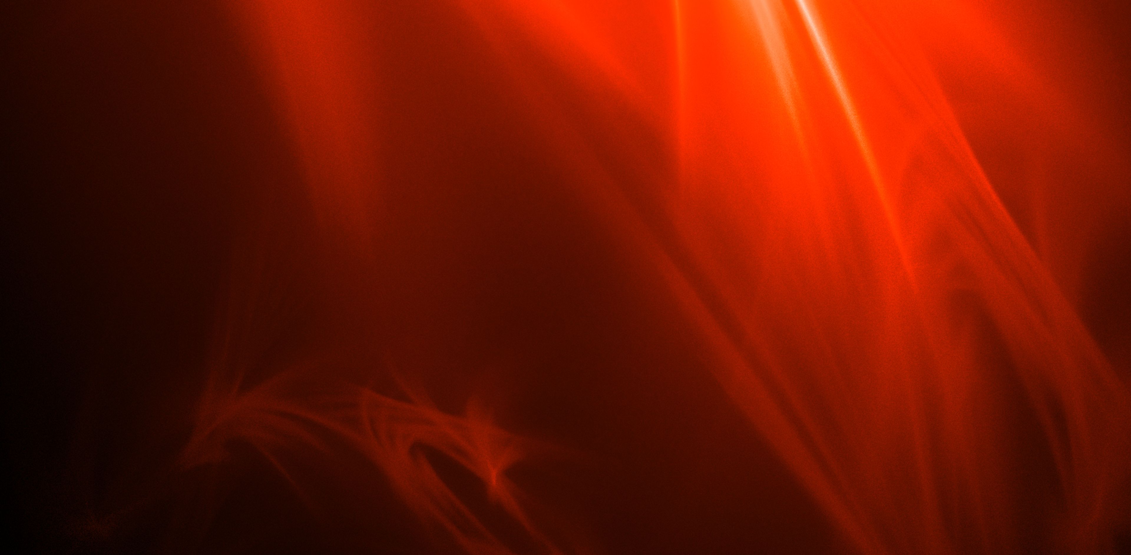 Black background image with red , orange and  white light flares