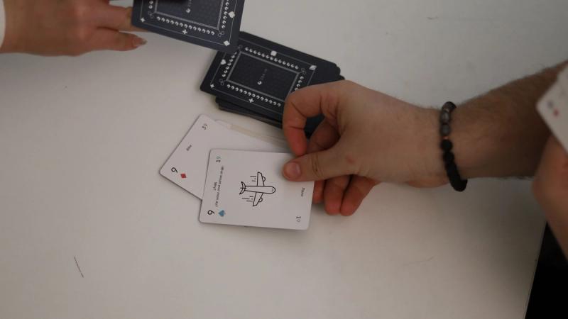 A player plays a third Nine card on the stack, forcing his opponent to draw a card.