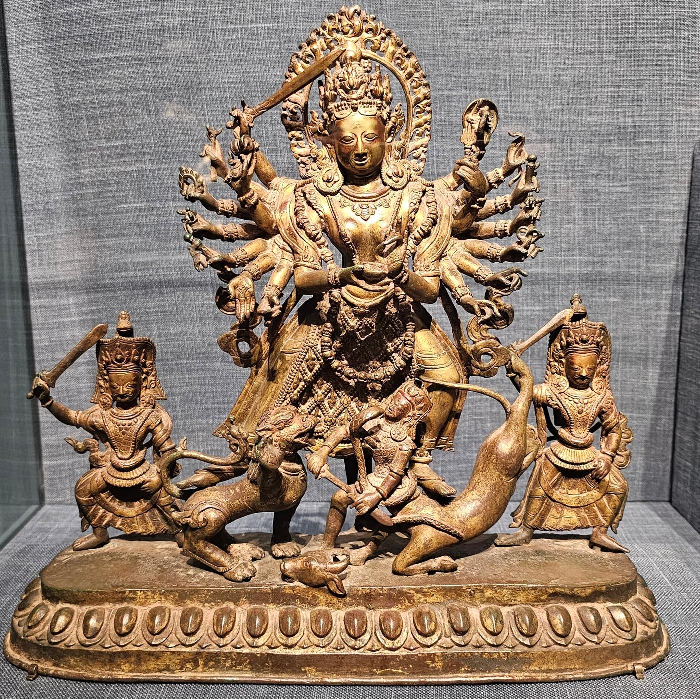 Gilded copper statue of the eighteen-armed goddess Durga Mahishasuramardini triumphing over the buffalo demon, Nepal, 18th century, Philadelphia Museum of Art