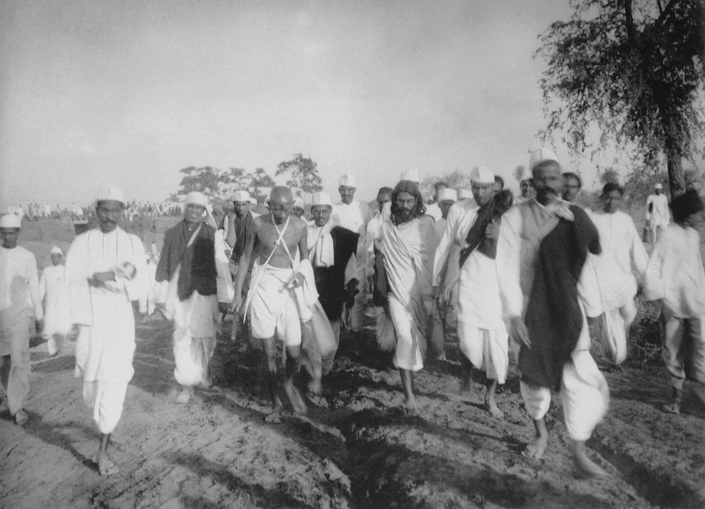 Mahatma Gandhi walking with followers during the Salt March, 1930