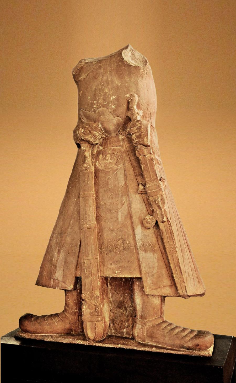 The headless sandstone statue of Kushan emperor Kanishka I, inscribed in Kharosthi script, from Mat near Mathura