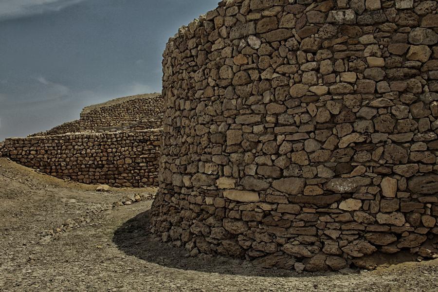 Ancient dry-stone fortification walls at the archaeological site of Banbhore in Sindh, Pakistan, widely identified with the port city of Debal