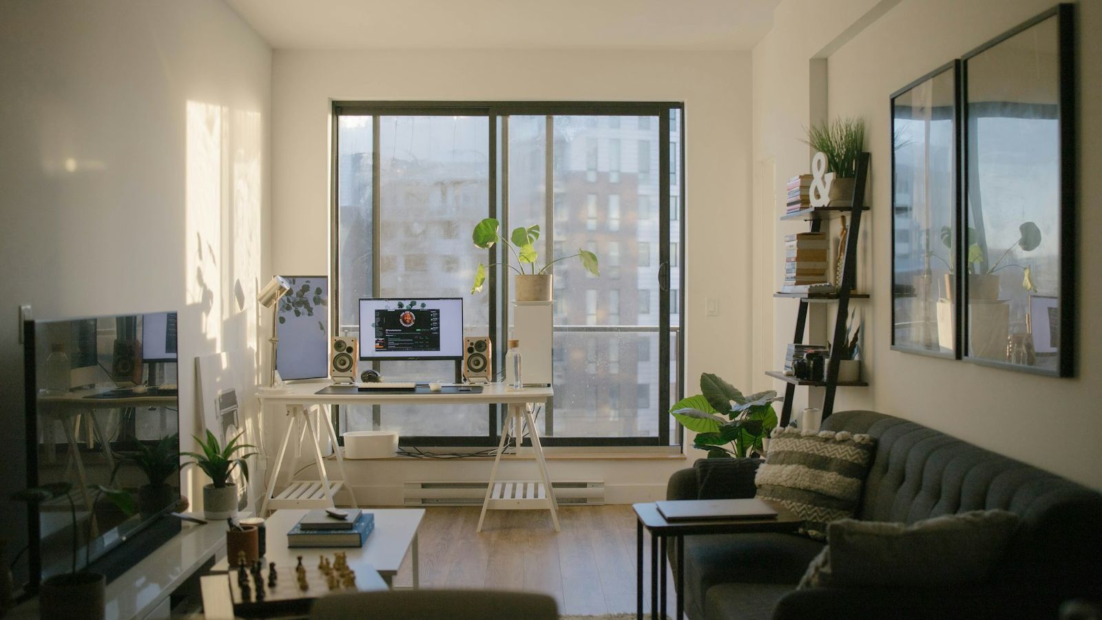 Modern apartment living room with sofa near glass window