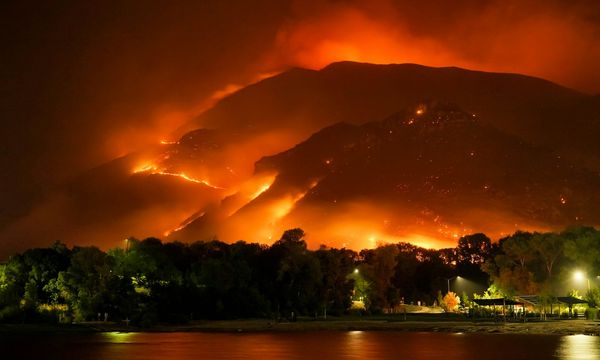 A large wildfire burning in the mountains