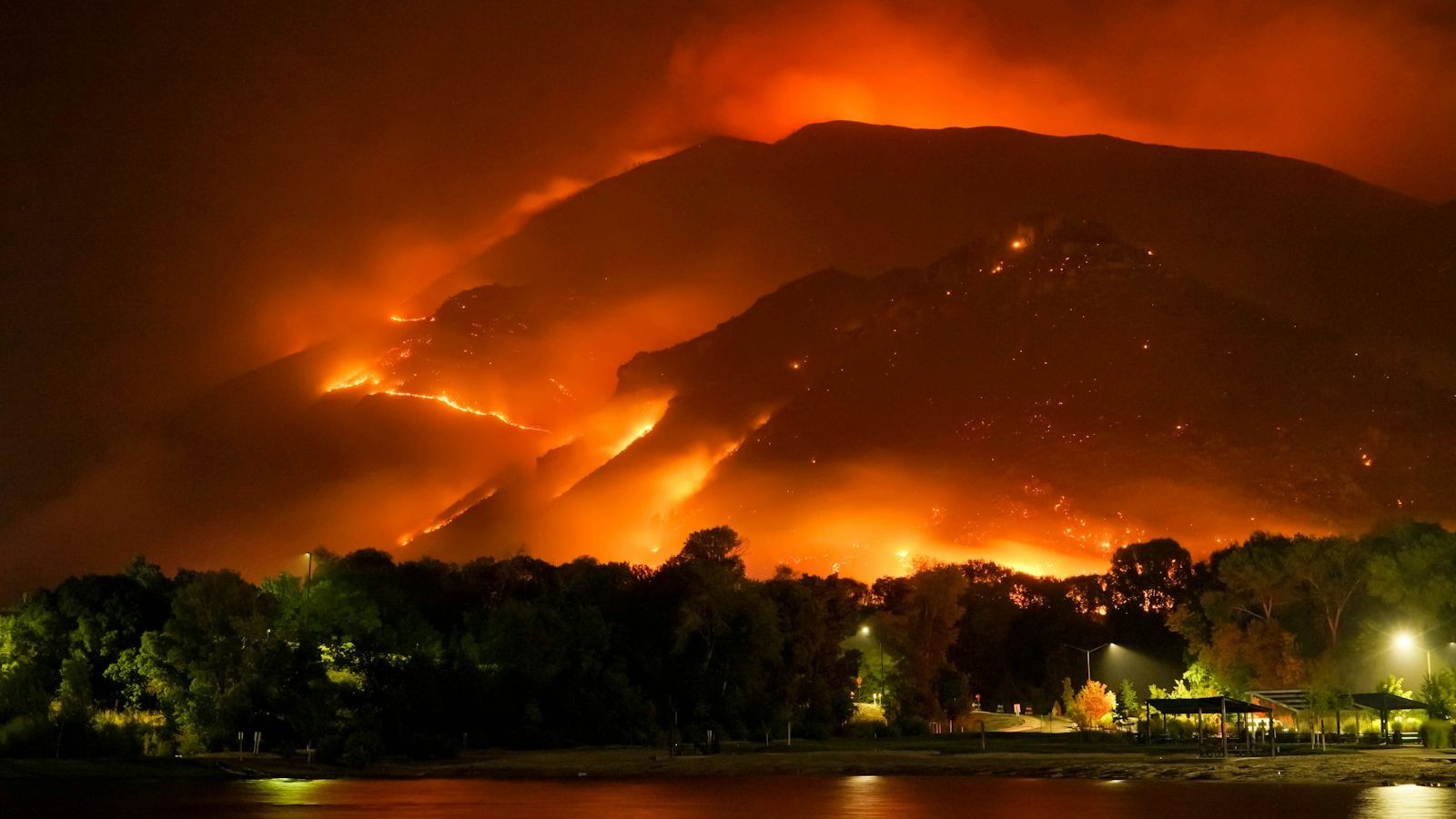 A large wildfire burning in the mountains