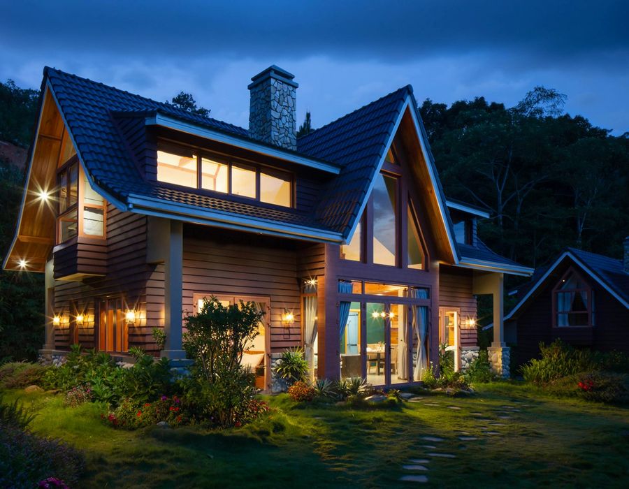 A modern California home with a car parked in front, representing home and auto insurance bundling