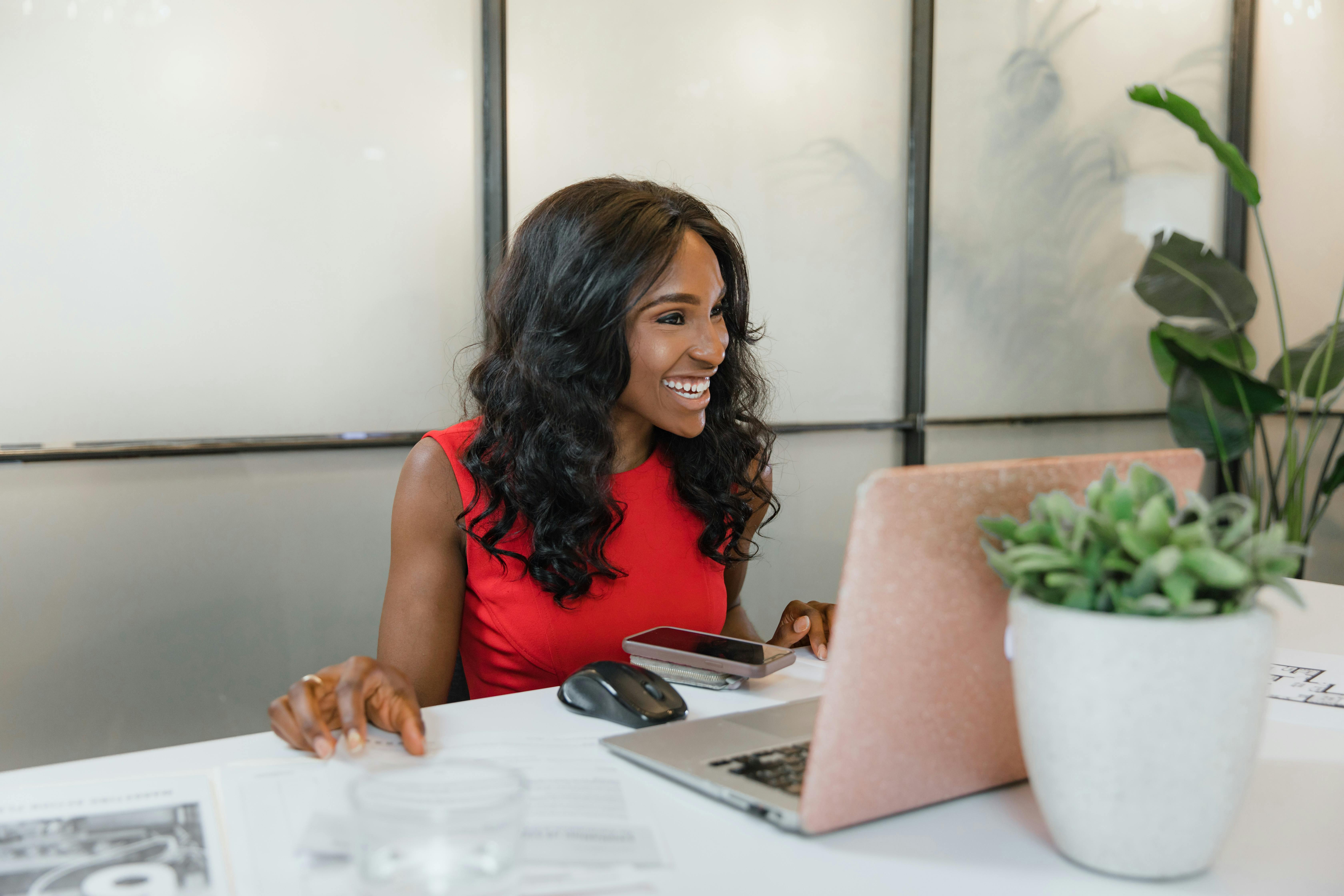 Professional woman at her desk, energised and focused