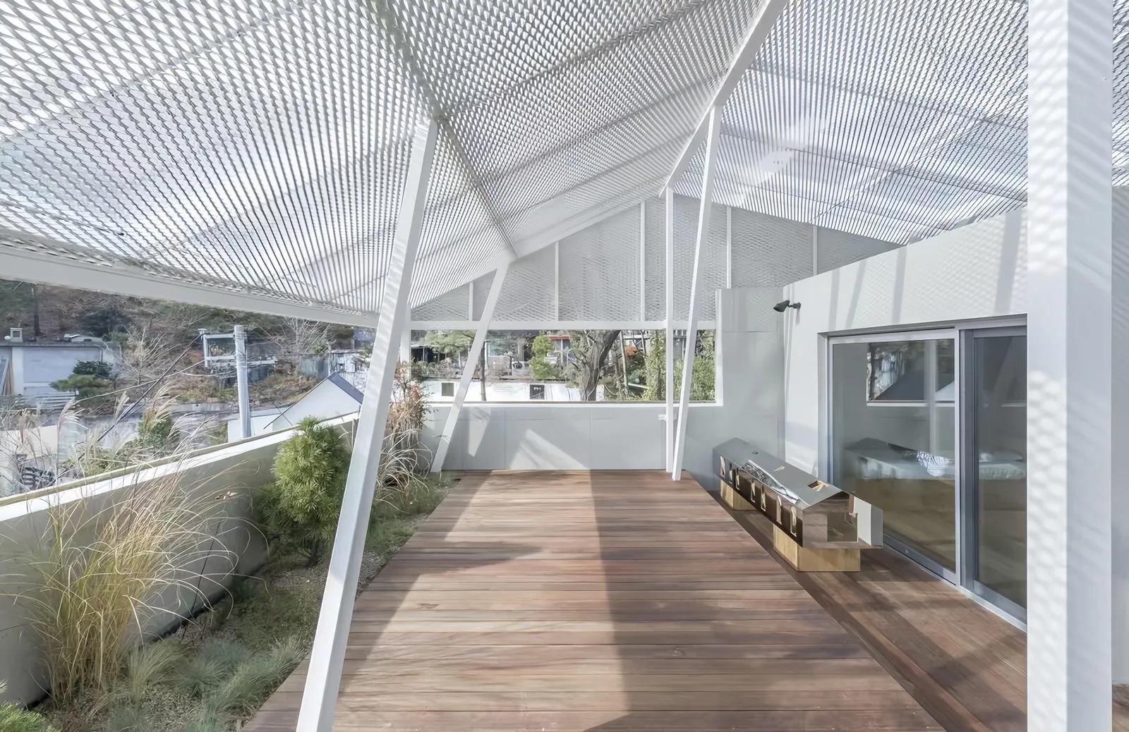 Expanded metal facade screen in an outdoor architectural application requiring durable finish selection