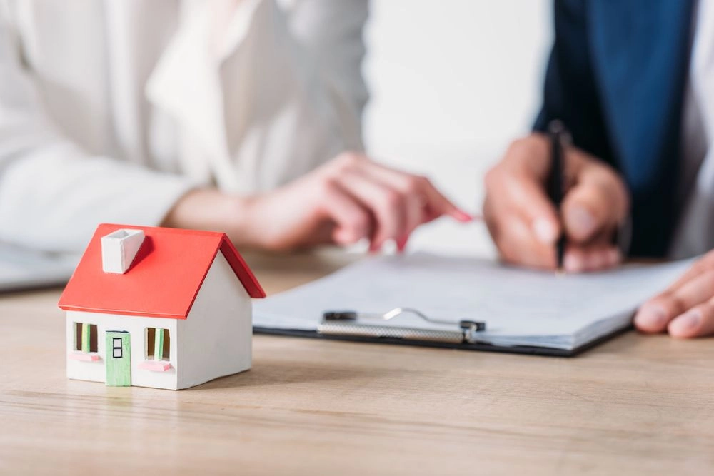 Signing home refinancing documents.