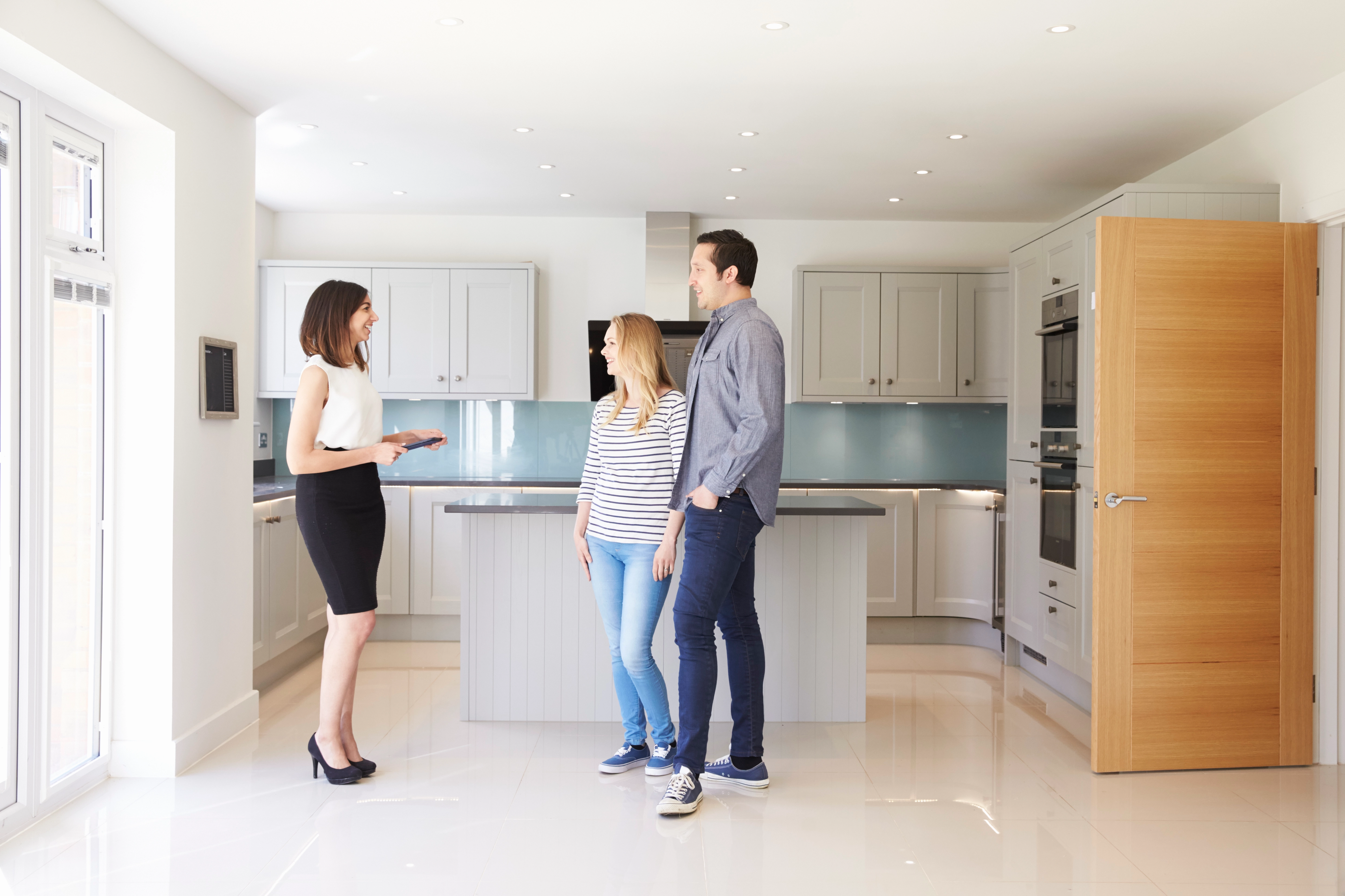 Home buyers touring with a Phoenix real estate agent.