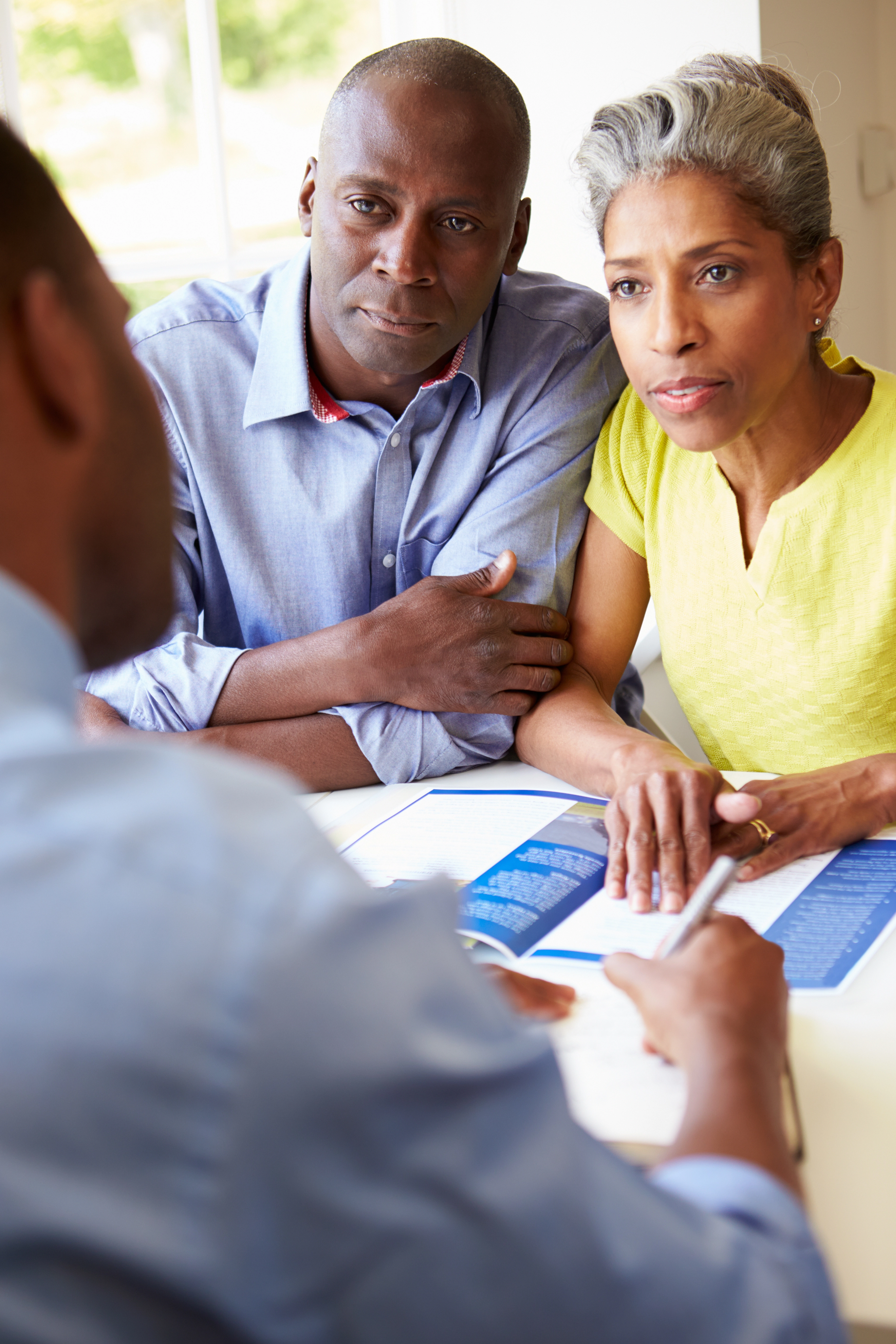 Loan officer discussing reasons of mortgage rejection 