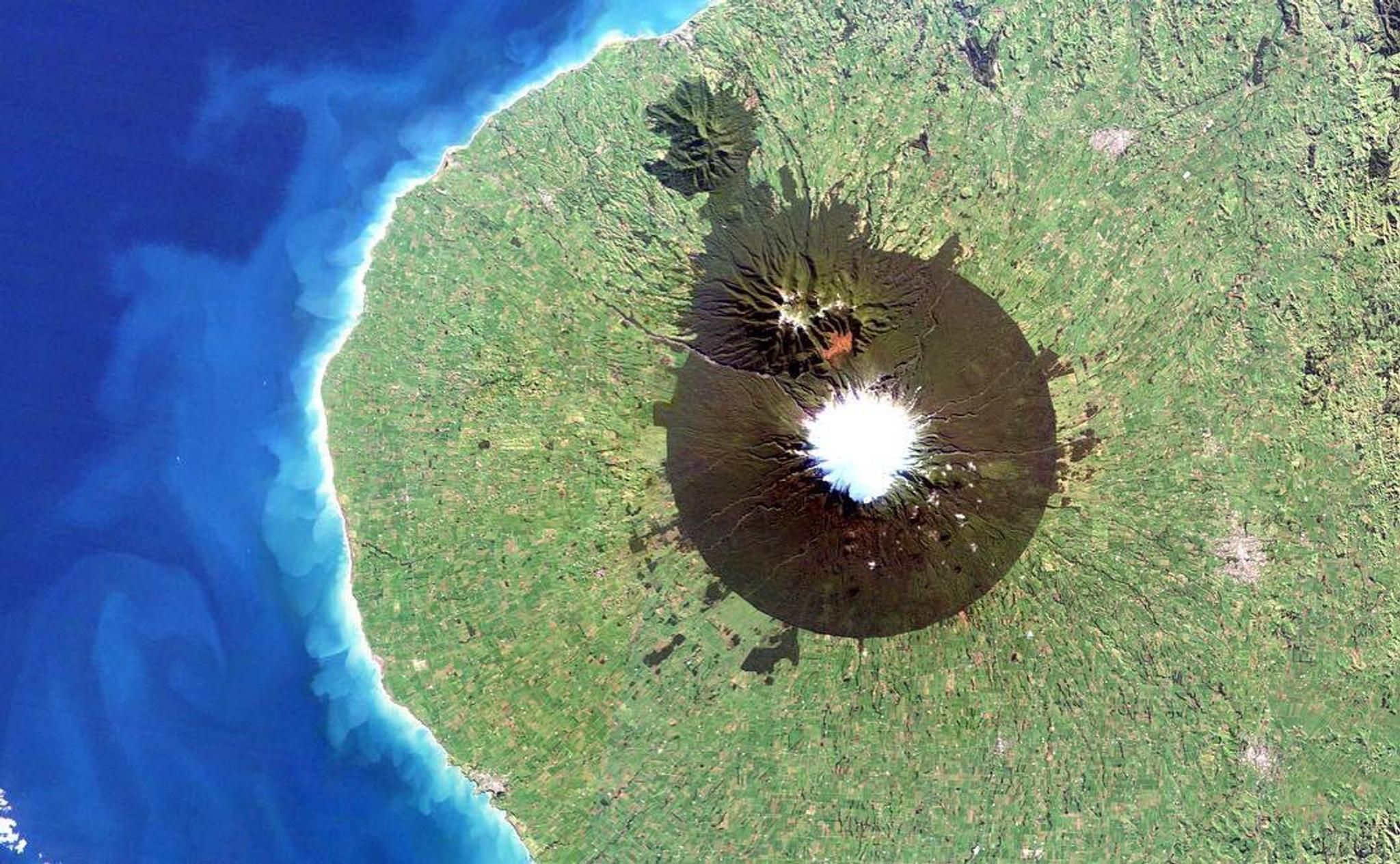 Mount Taranaki - dubbed shining mountain after its snow-clad peaks - captured on June 28, 2018 by a RapidEye satellite © 2018, Planet Labs Inc. All Rights Reserved.