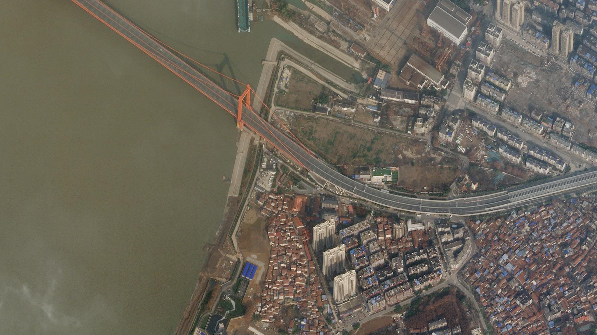 Planet imagery of the empty Yingwuzhou Yangtze River Bridge on January 28, 2020 during the COVID-19 lockdown in Wuhan, China. © 2020, Planet Labs Inc. All Rights Reserved.