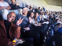 team members cheering at a stadium