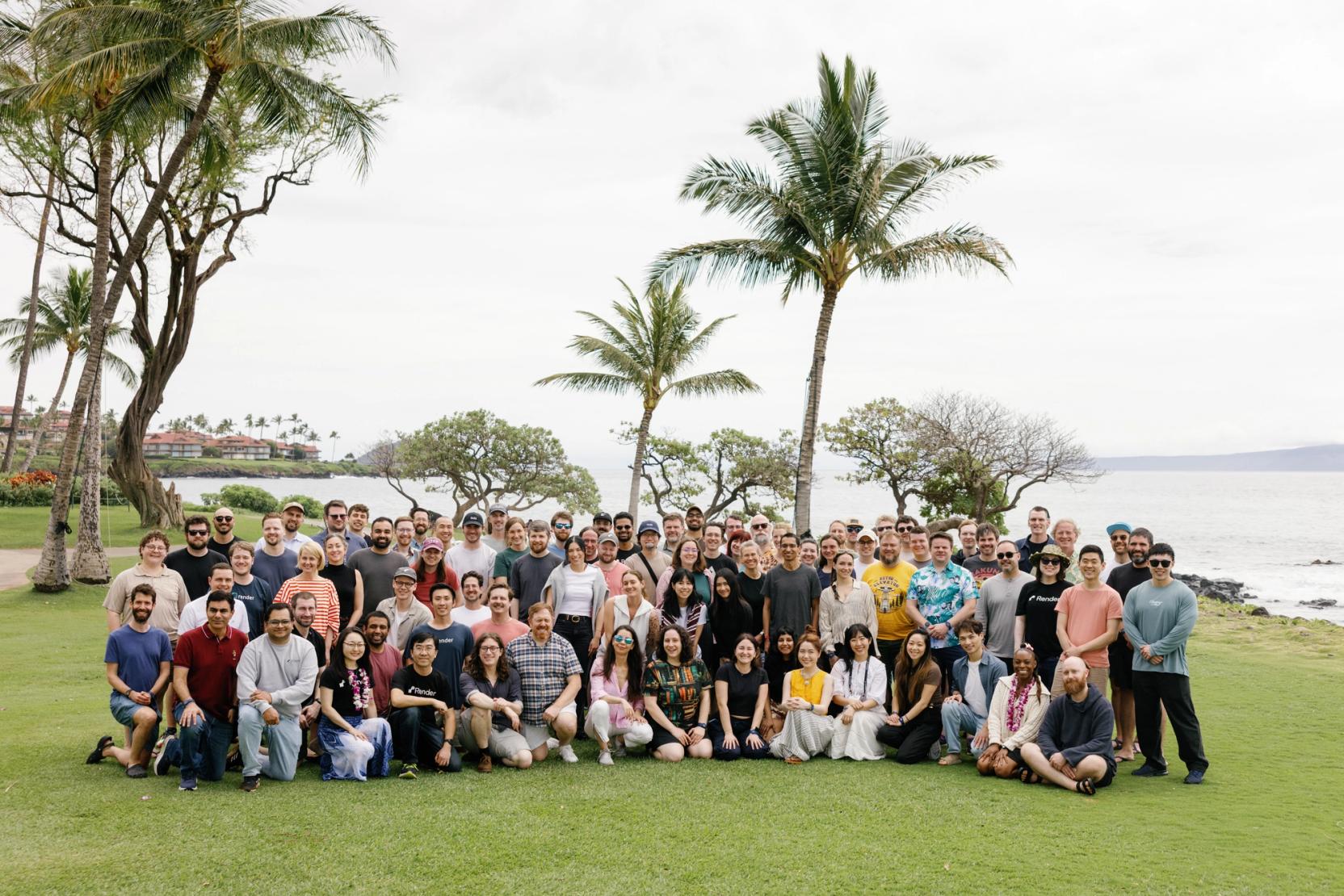 large team photo on a tropical lawn