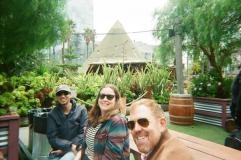 three coworkers taking a selfie in a garden