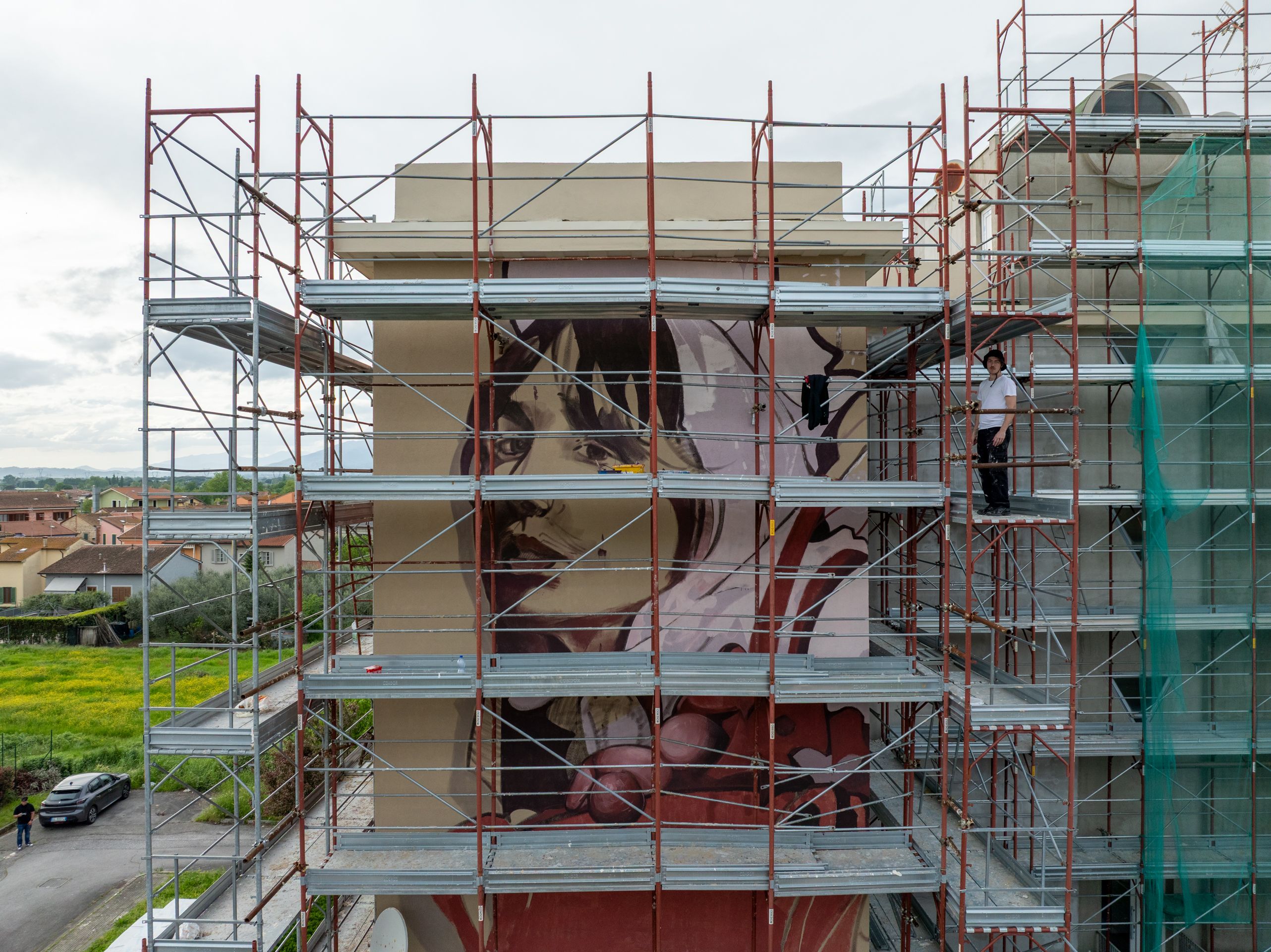 zona16-mural-migrazioni-cintolese-scaffolding-side-jpg