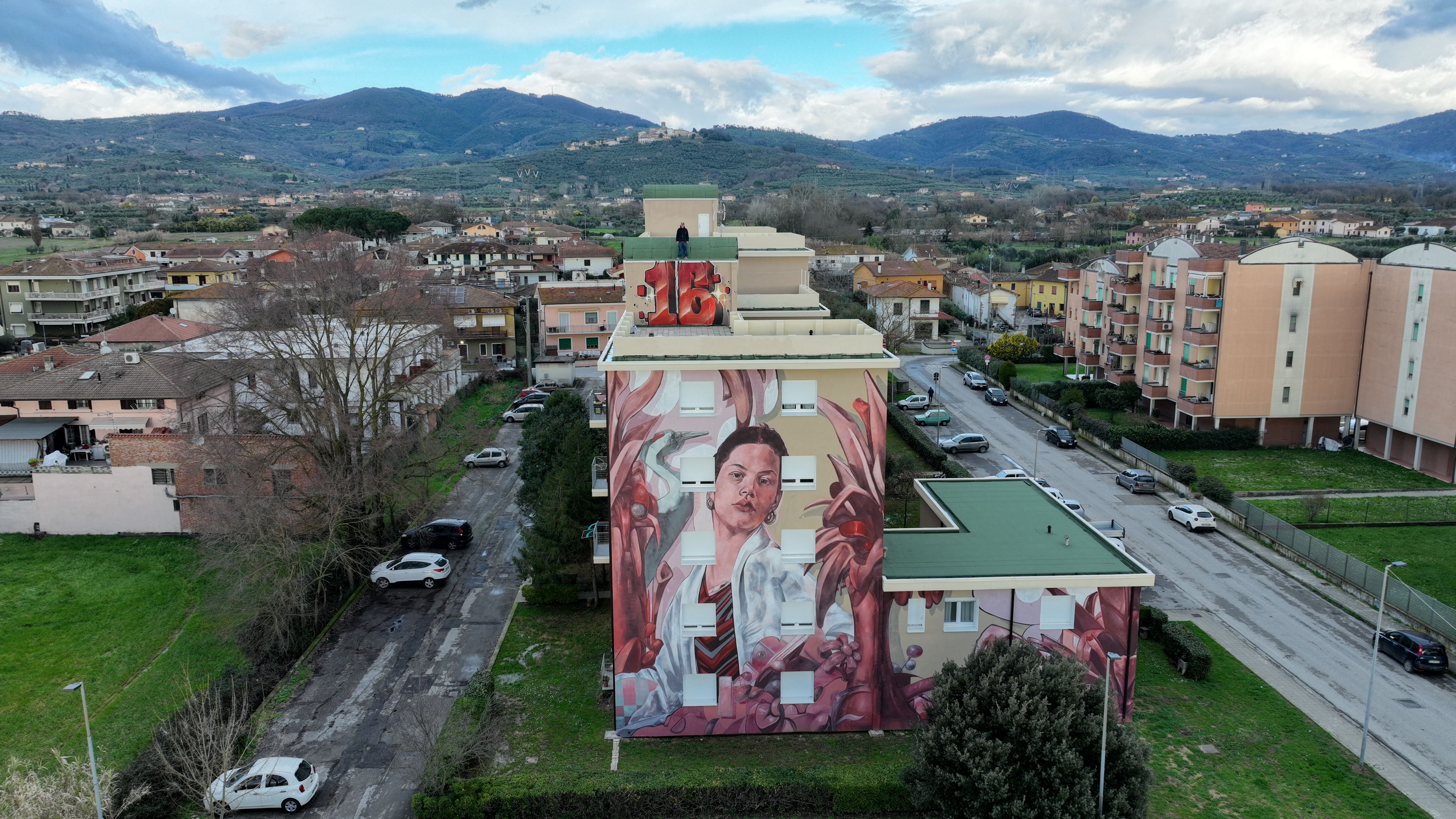 zona16-mural-migrazioni-cintolese-skyview-side-jpg