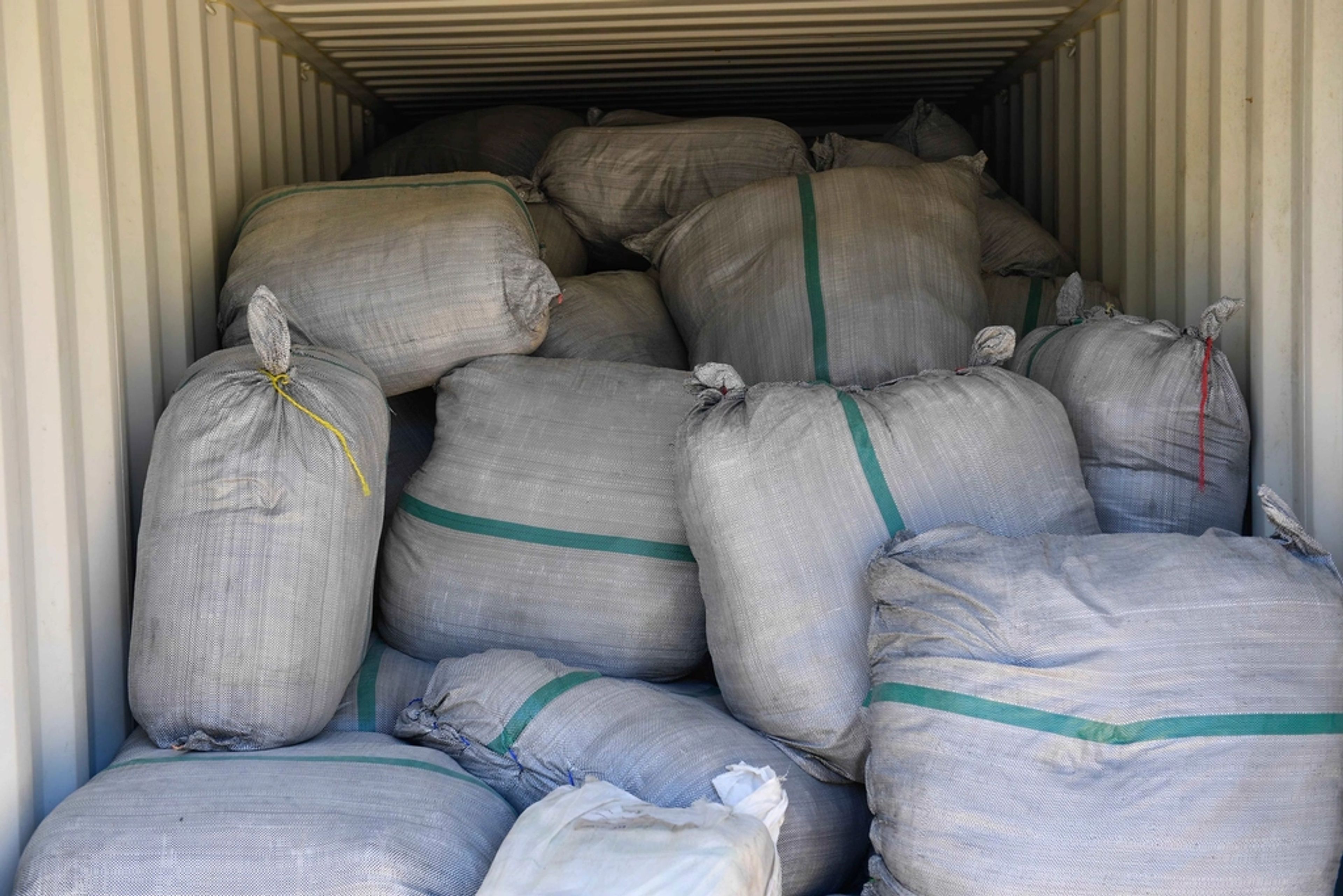 Relief supply sacks staged inside a shipping container