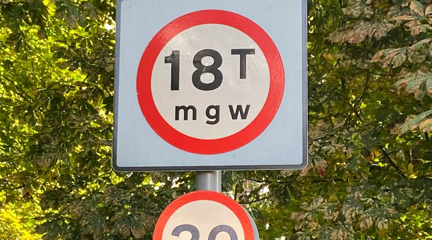 "WEAK BRIDGE 18T mgw" warning sign with a 30mph sign below - bridge height limit uk