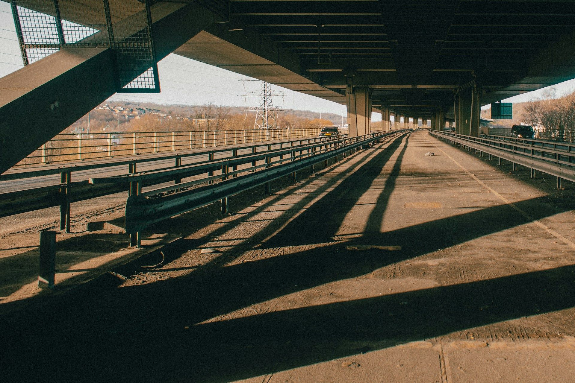 Looking up under a concrete motorway viaduct - bridge height limit uk