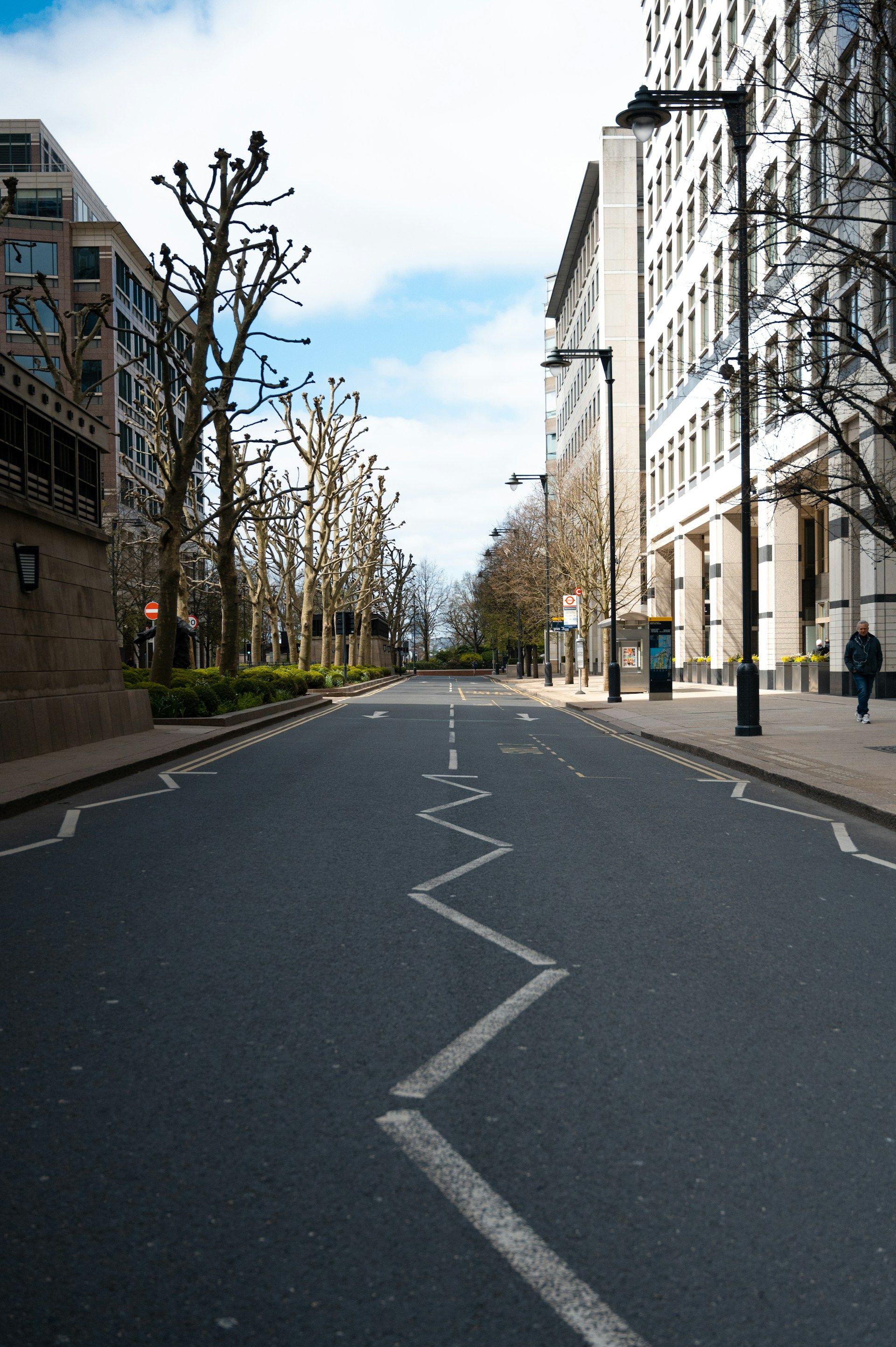 London city street with prominent white zigzag road markings in the foreground - pedestrian zones uk