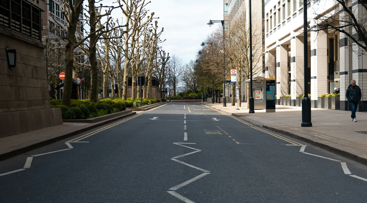 London city street with prominent white zigzag road markings in the foreground - pedestrian zones uk