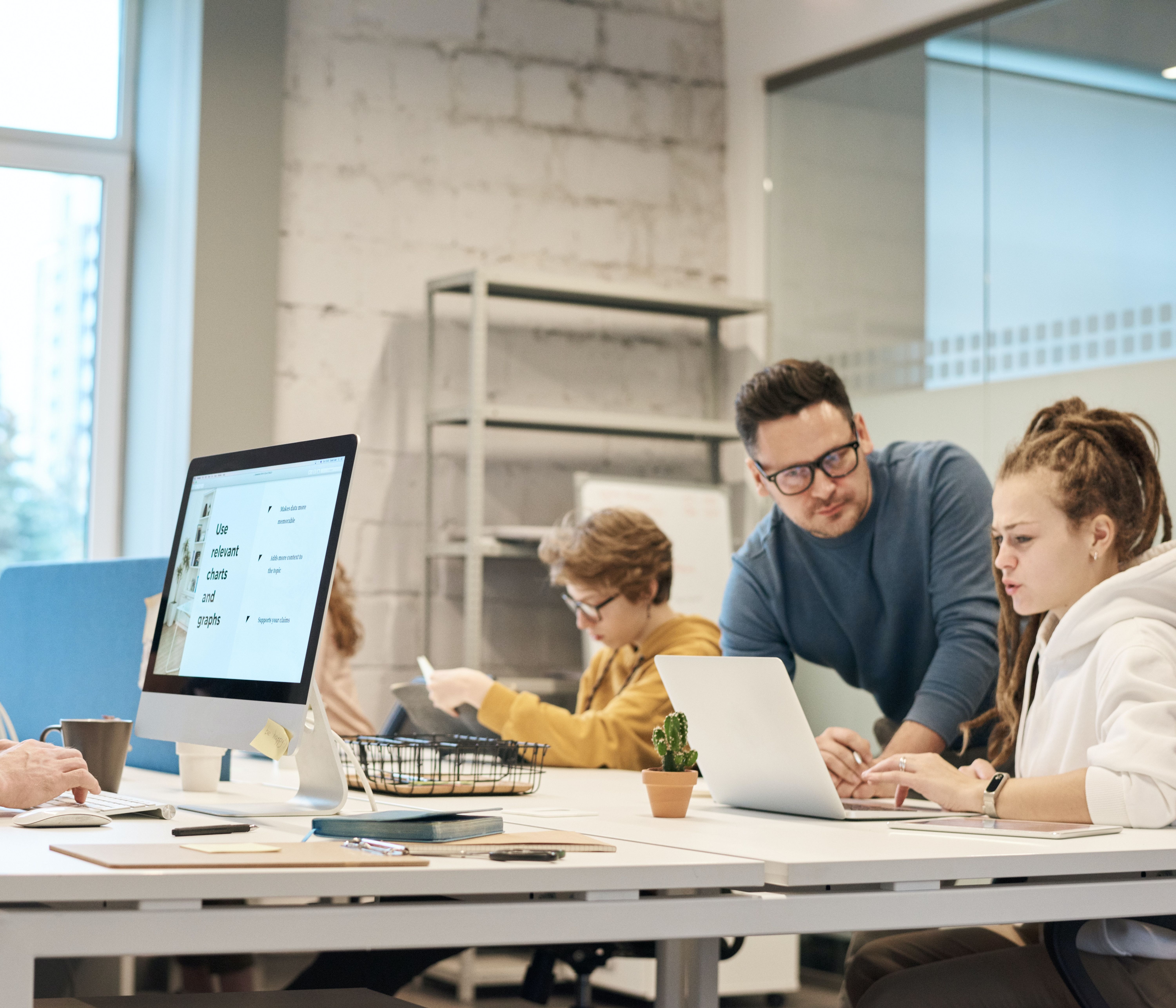A busy office full of young professionals.
