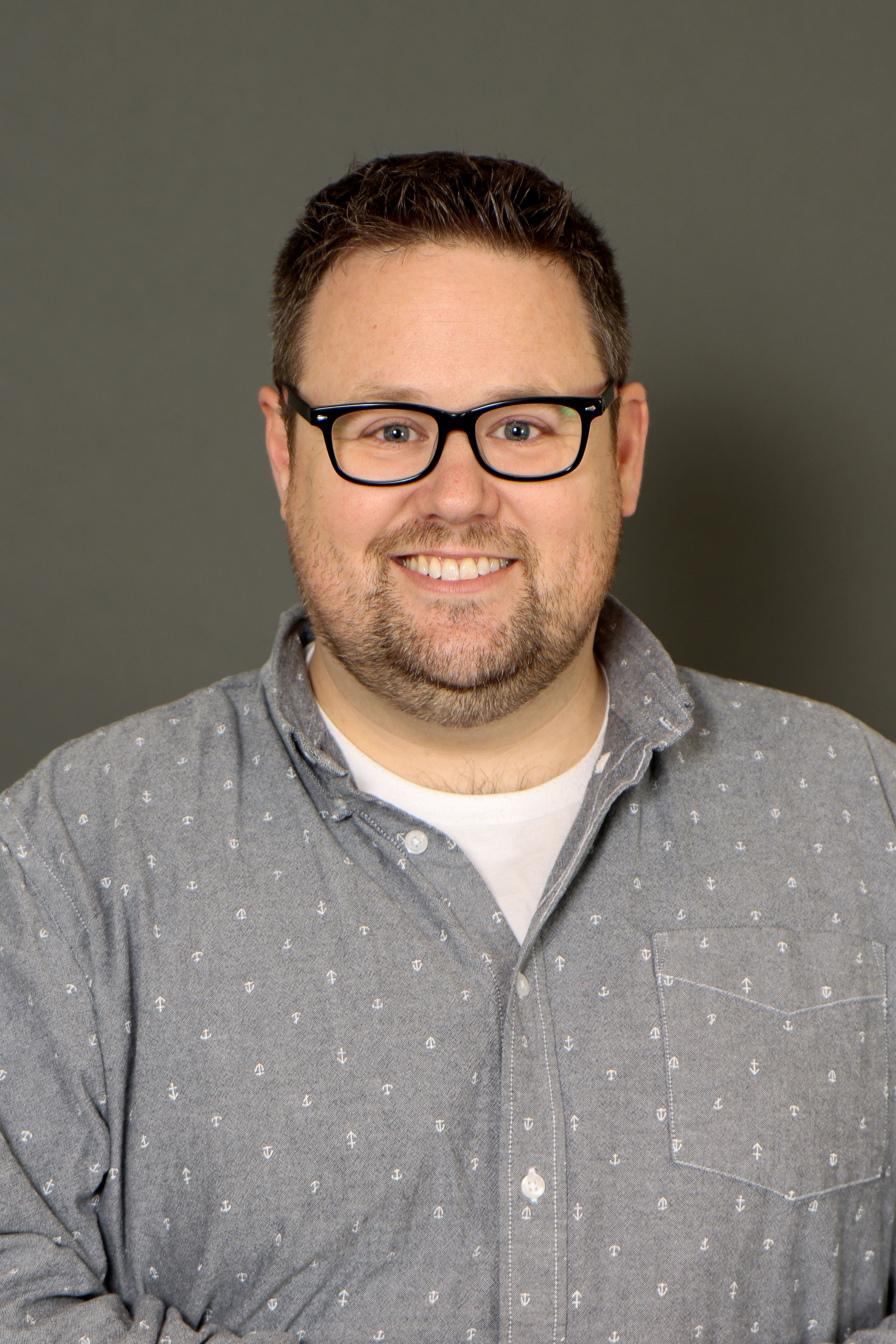 Ryan McKelvie headshot on a dark background