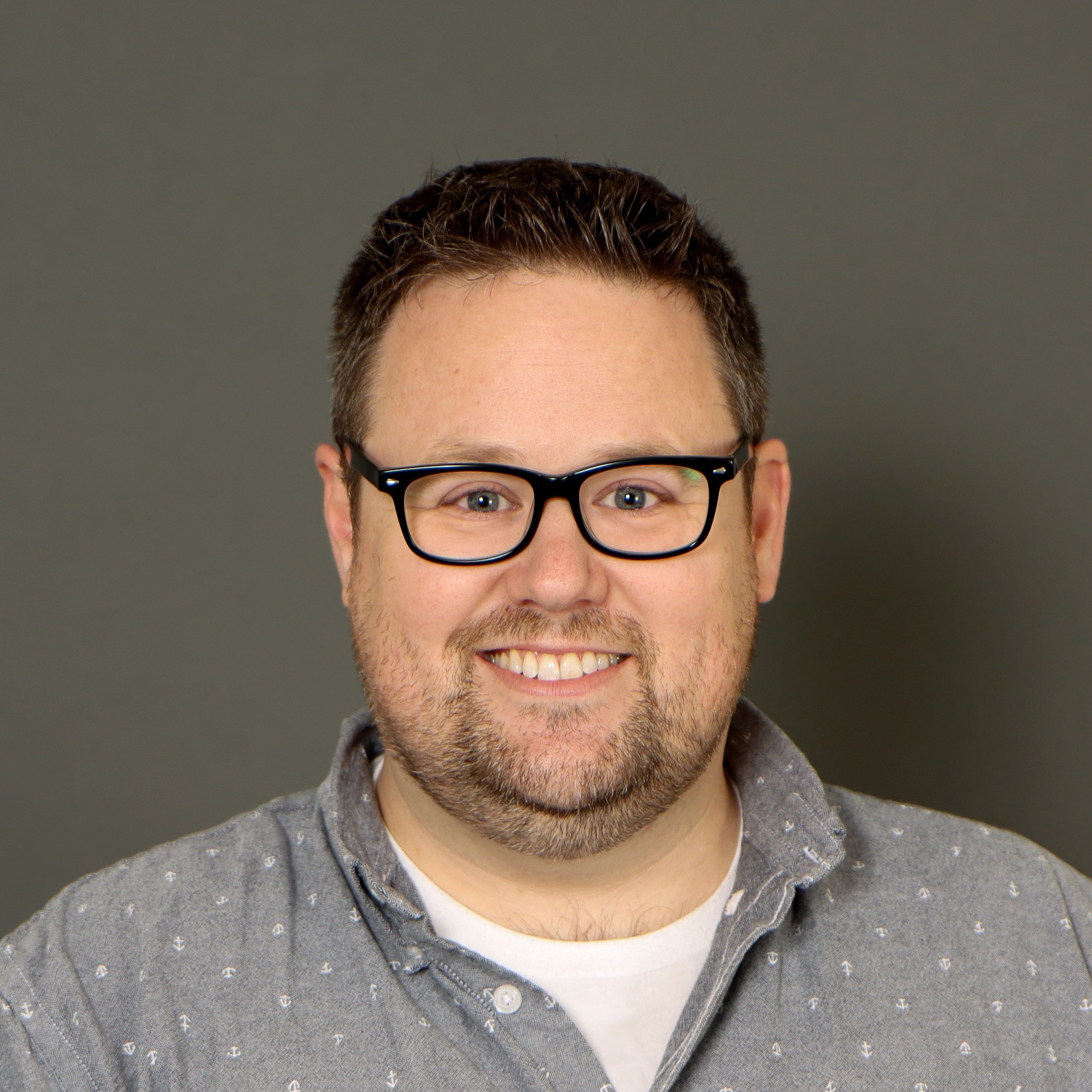 Ryan McKelvie headshot on a dark background